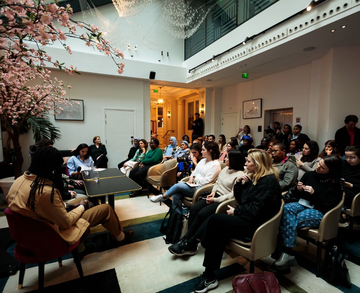 Professional conference at Fauchon L’Hôtel Paris, with participants seated in a theater-style layout facing a speaker.