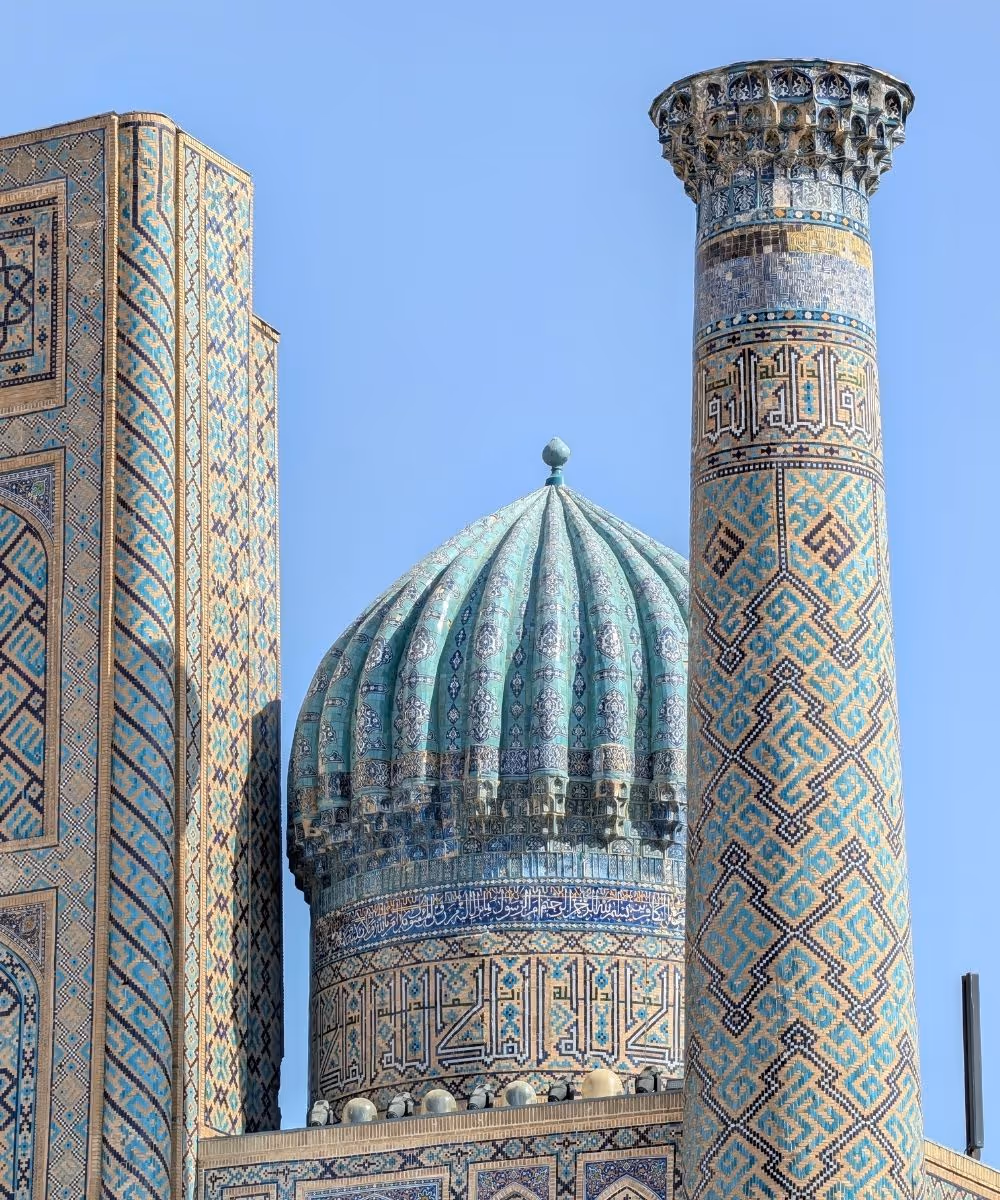 The Ulugh Beg Madrasah featuring a ribbed turquoise tiled dome at the Registan in Samarkand, Uzbekistan.