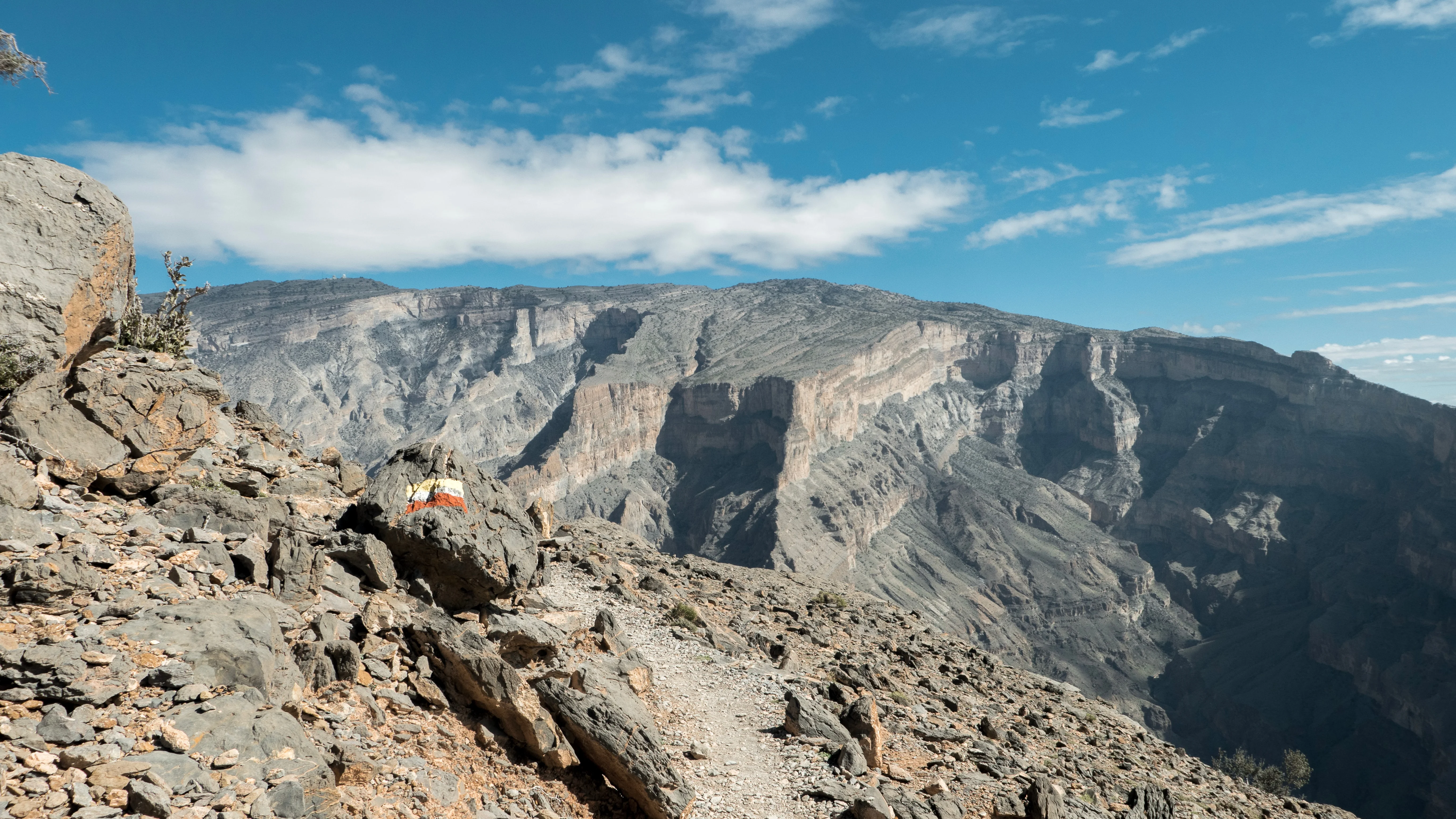 Rocky trail view of Jebel Shams mountains during a guided Oman tour hike.