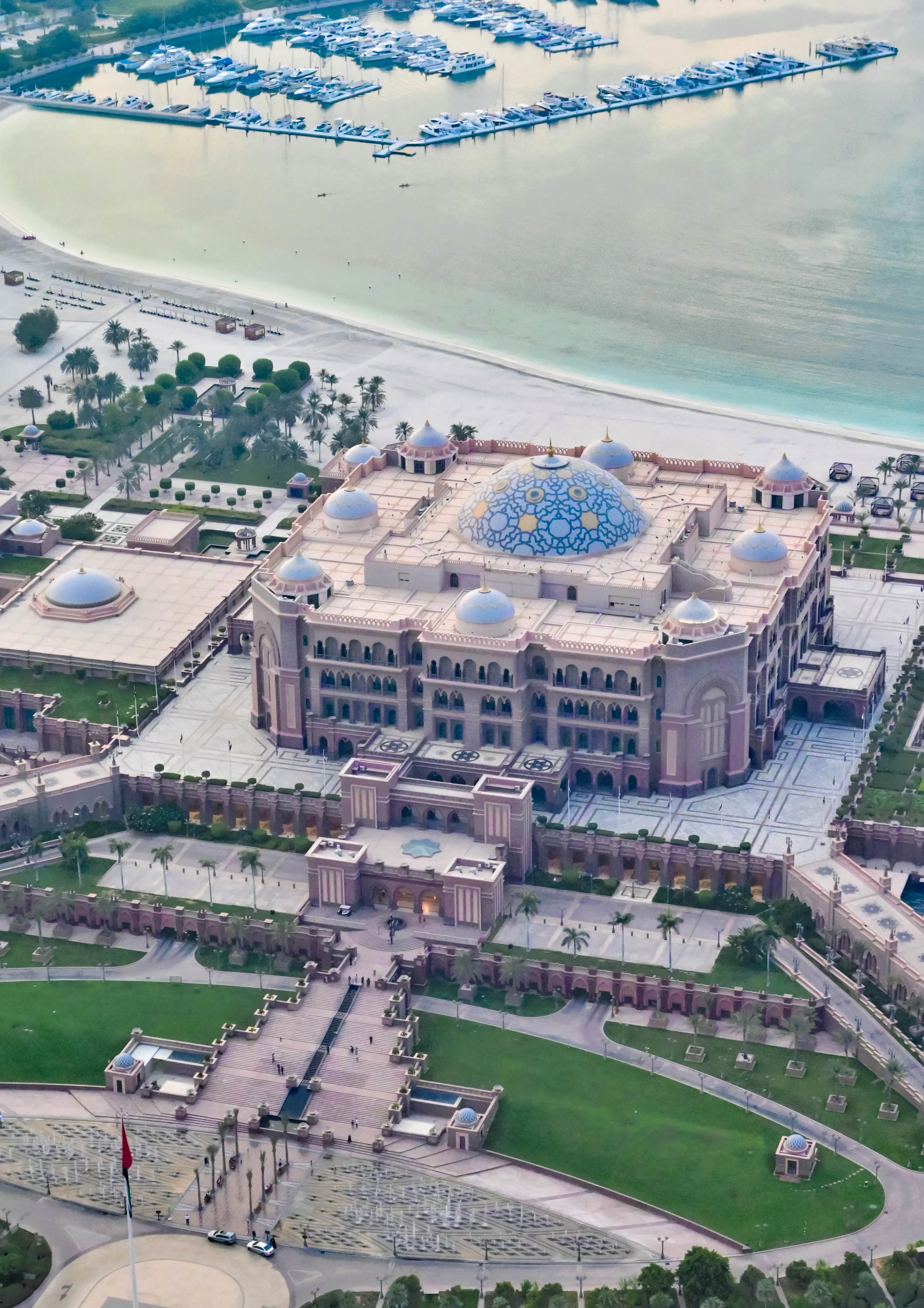Aerial view of Emirates Palace with marina and beach