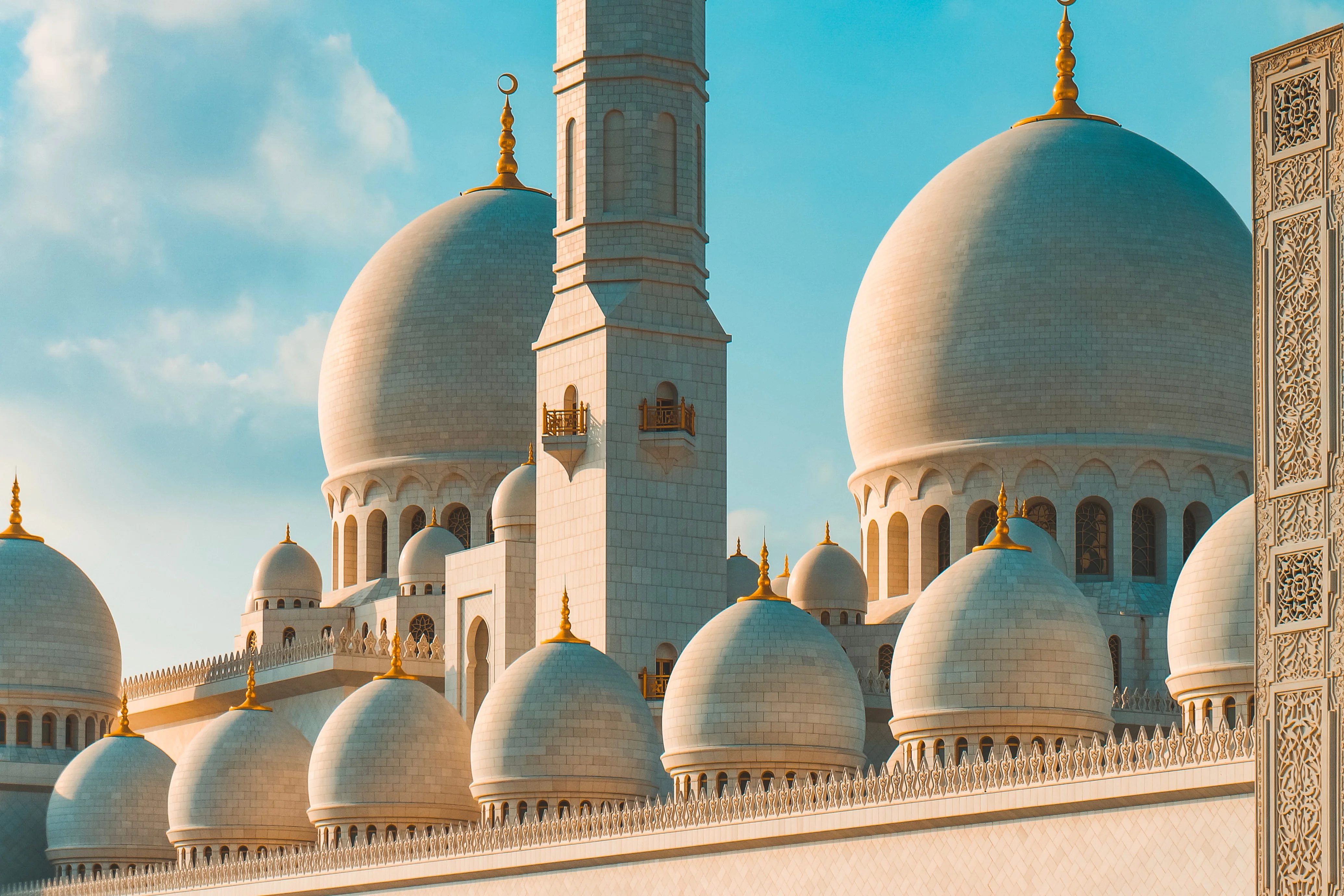 Sheikh Zayed Grand Mosque domes and minaret with golden details