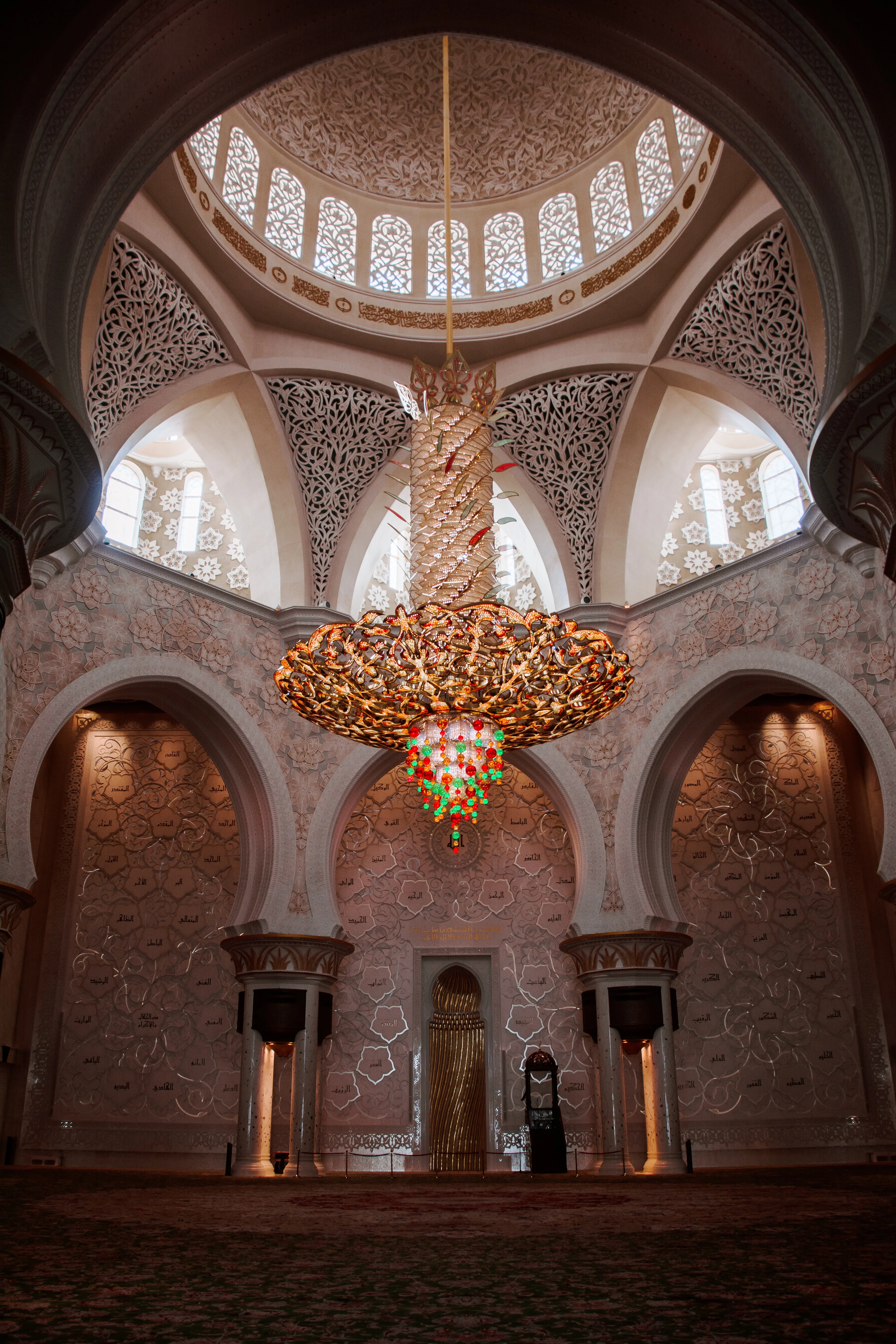 Wide view of mosque chandelier and arches in Grand Mosque