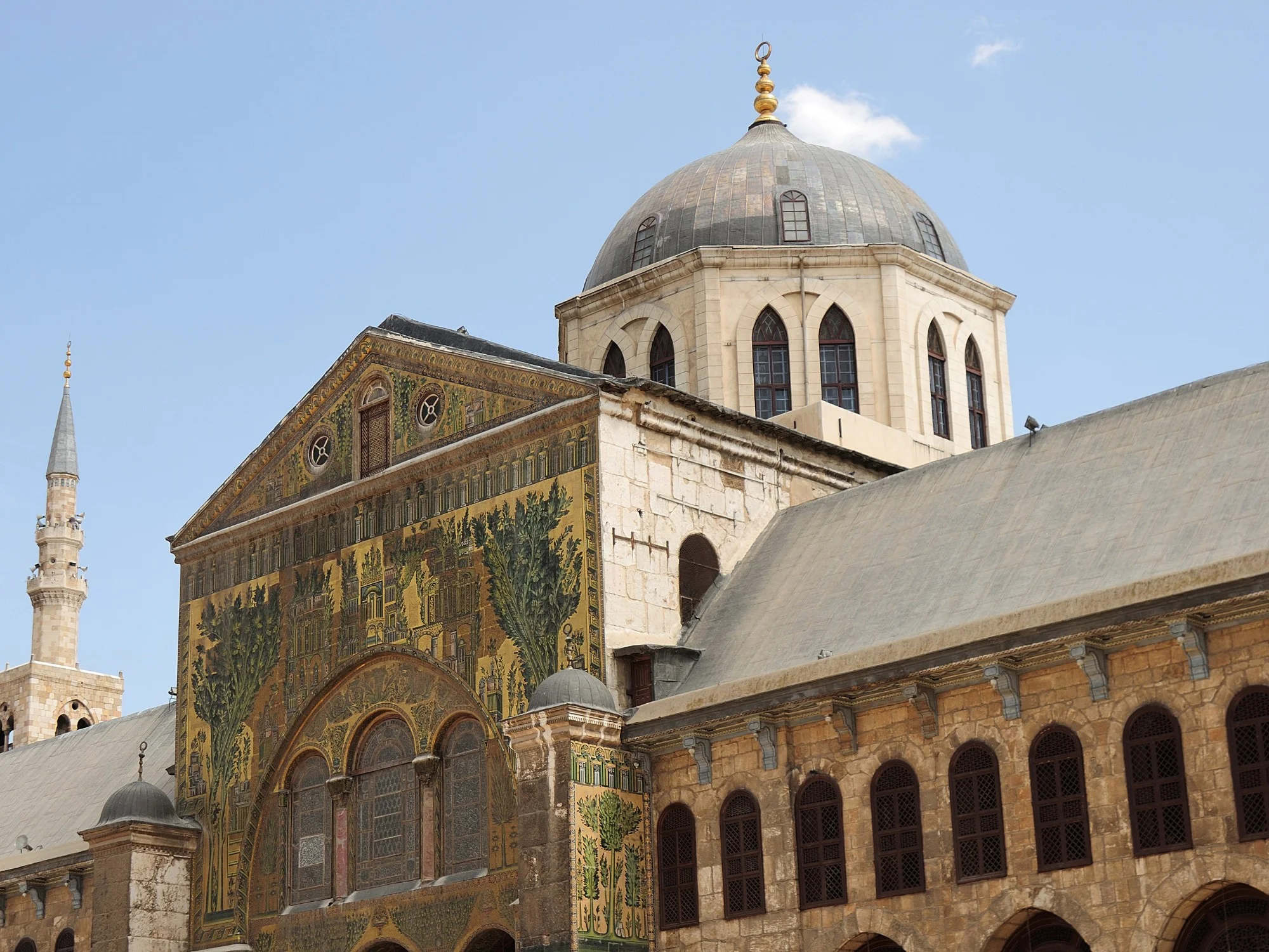 Exterior of the Umayyad Mosque in Damascus with mosaic facade and large central dome