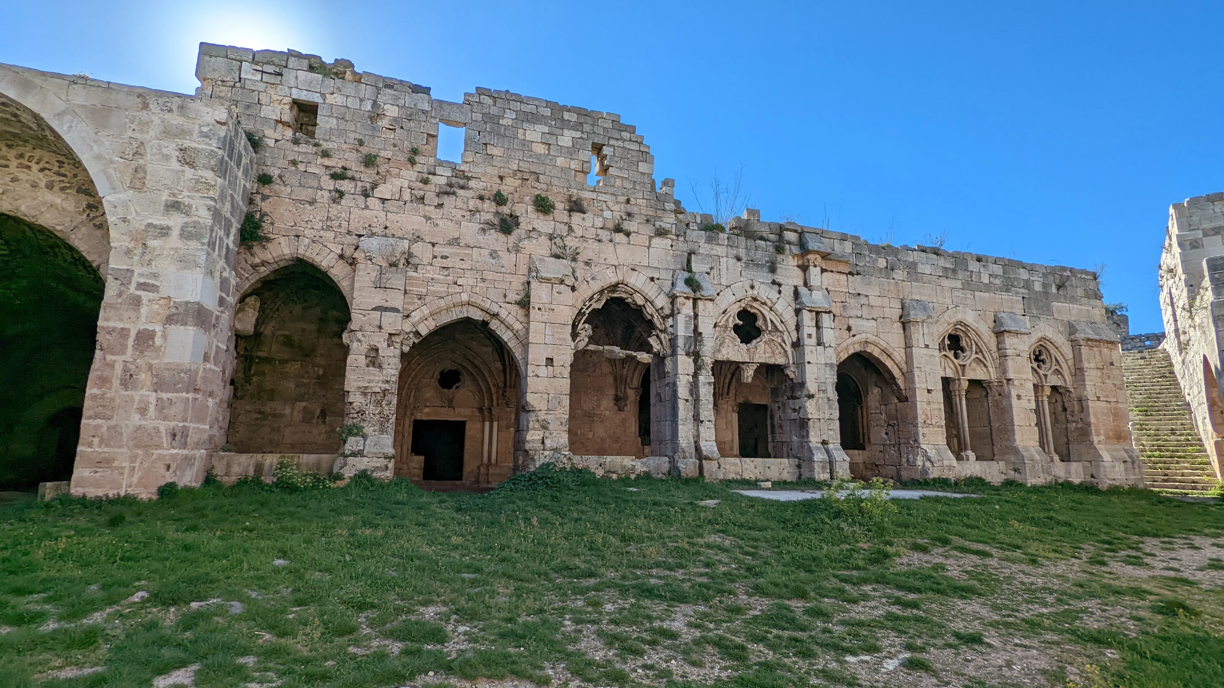 Interior stone arches of Krak des Chevaliers castle, partially ruined but rich in medieval architecture
