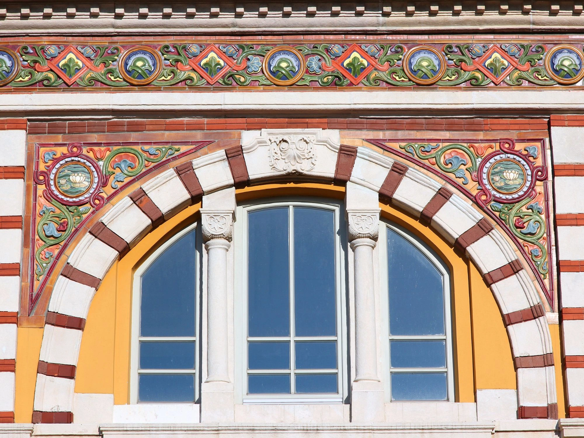Sofia Central Mineral Baths facade with colorful tiles and arched window detail.