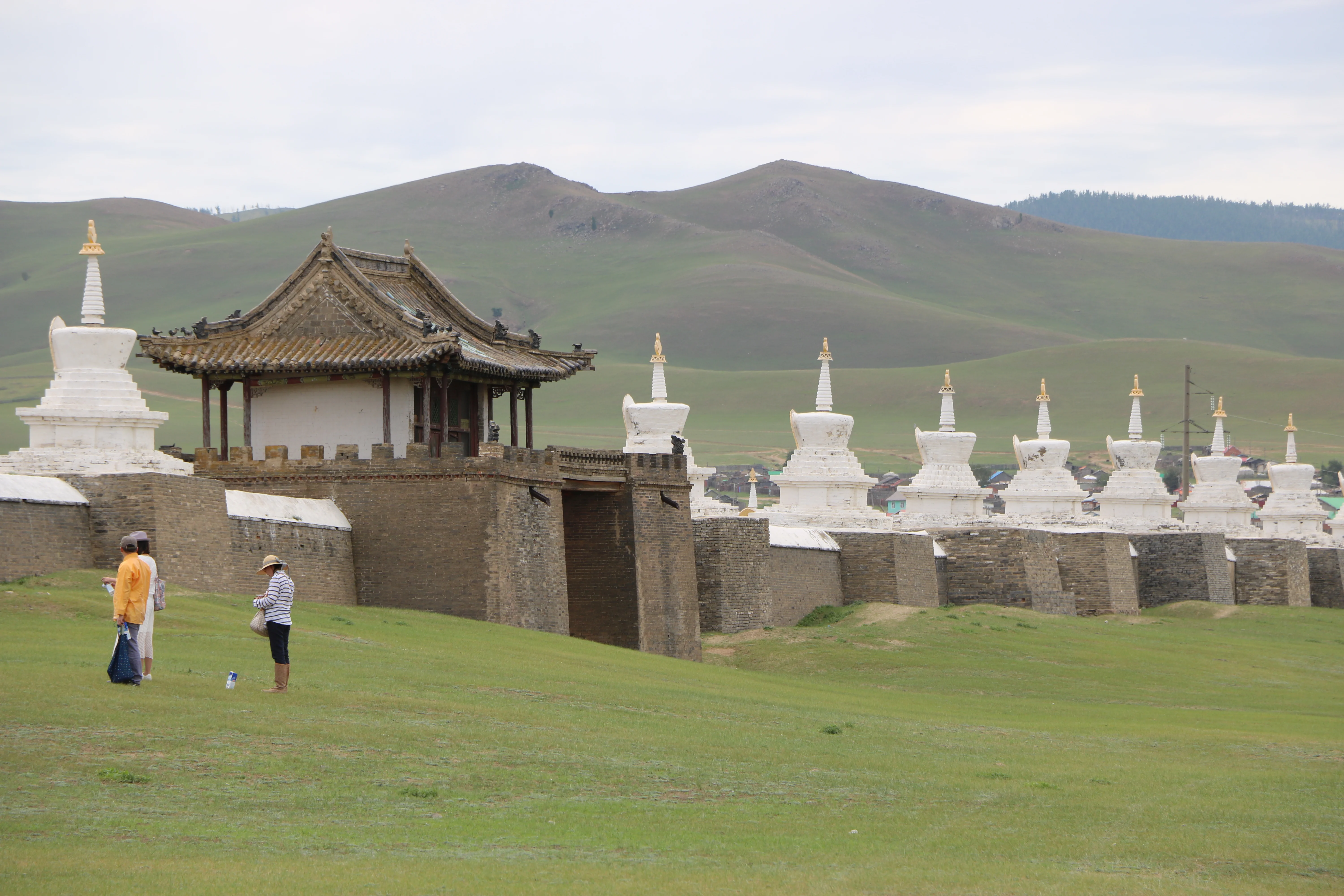 Erdene Zuu Monastery walls lined with stupas on Mongolian grasslands.