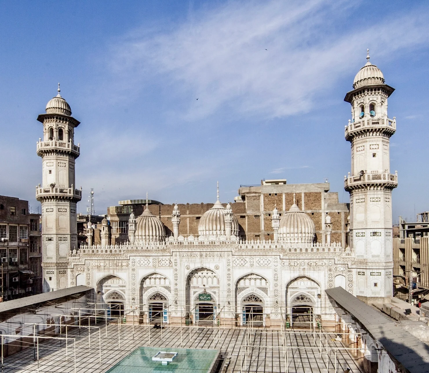 White marble Mohabbat Khan Mosque with ornate domes and minarets in Peshawar, Pakistan