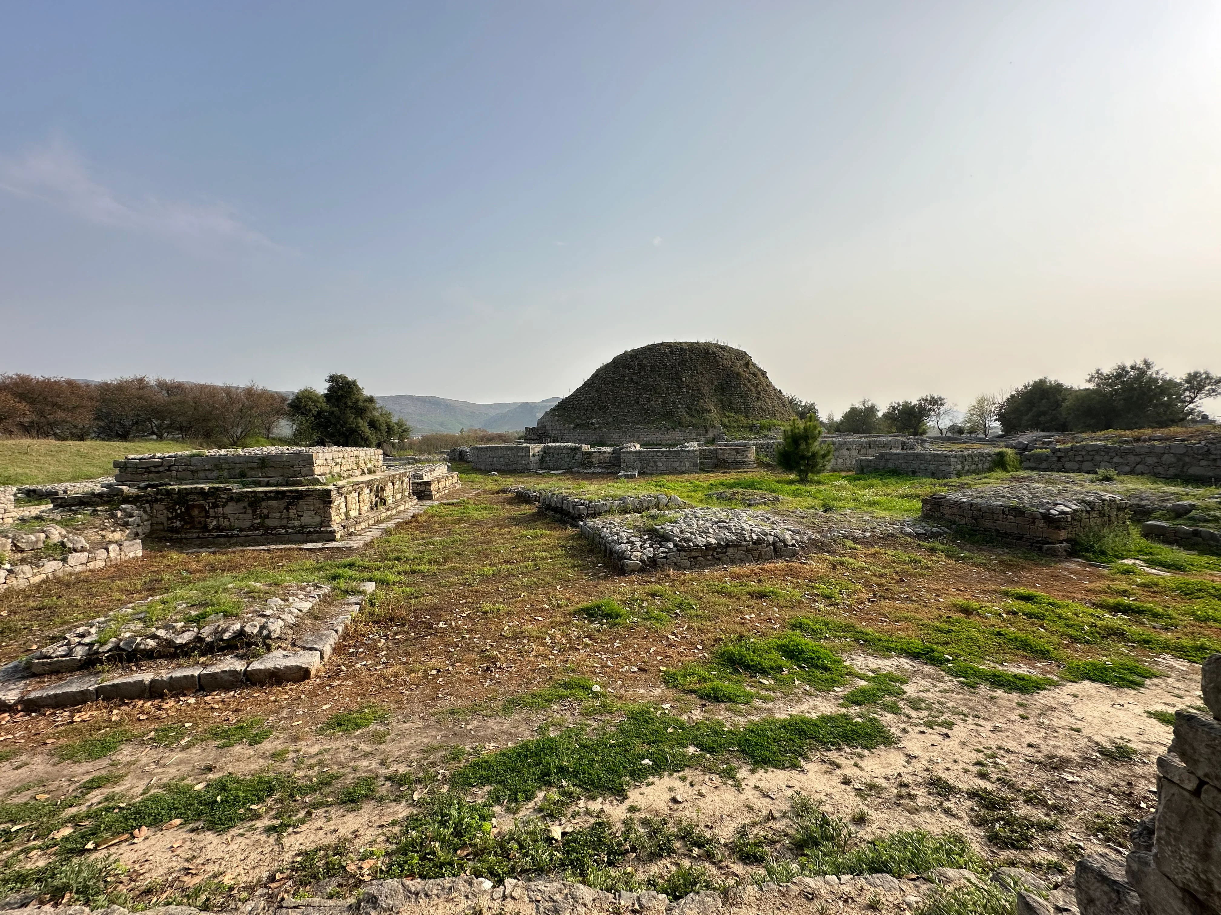 Ancient Taxila ruins and stupa in Pakistan, historic Buddhist site with stone walls.