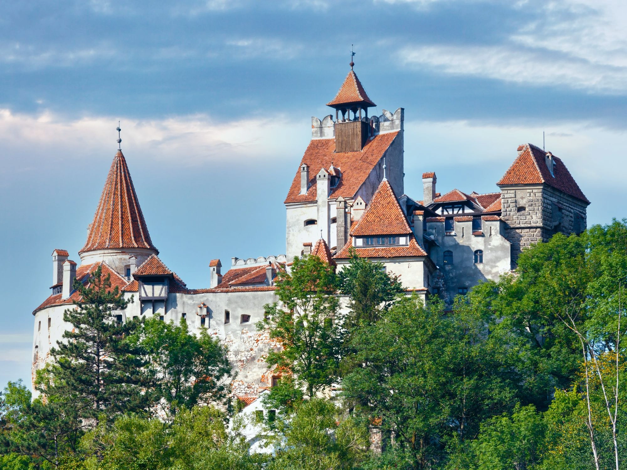 Famous Bran Castle, known as Dracula’s Castle, nestled in the forested hills of Romania