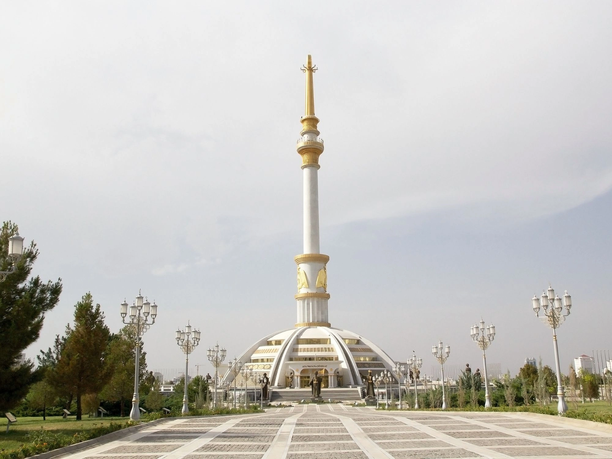 Monument of Neutrality in Ashgabat, Turkmenistan, with a golden statue atop a tall spire.
