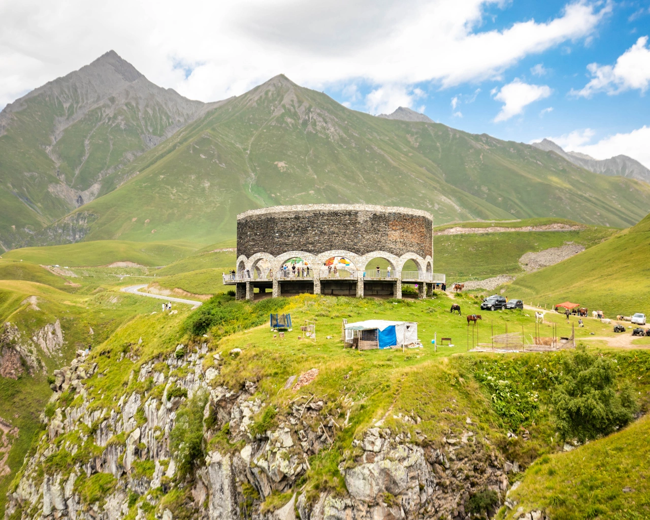 Gudauri Friendship Monument, Georgia - Iconic semicircular viewpoint in Georgia with murals depicting Russian-Georgian history.