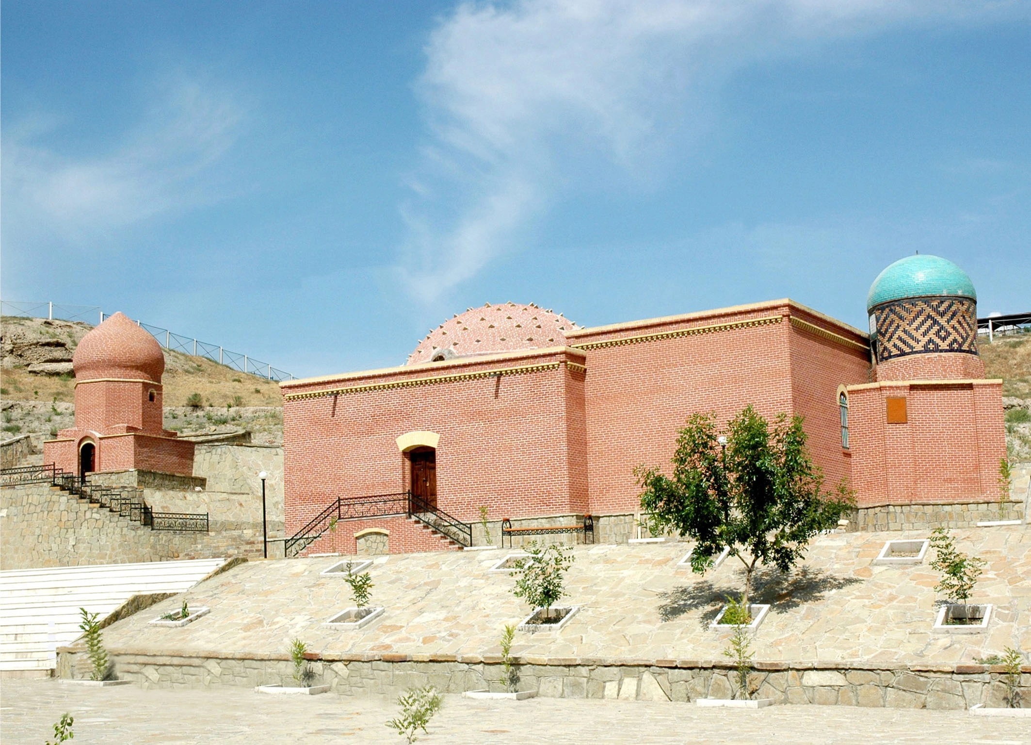 Imamzade Complex with domes and minarets blends into Nakhchivan's arid hills.