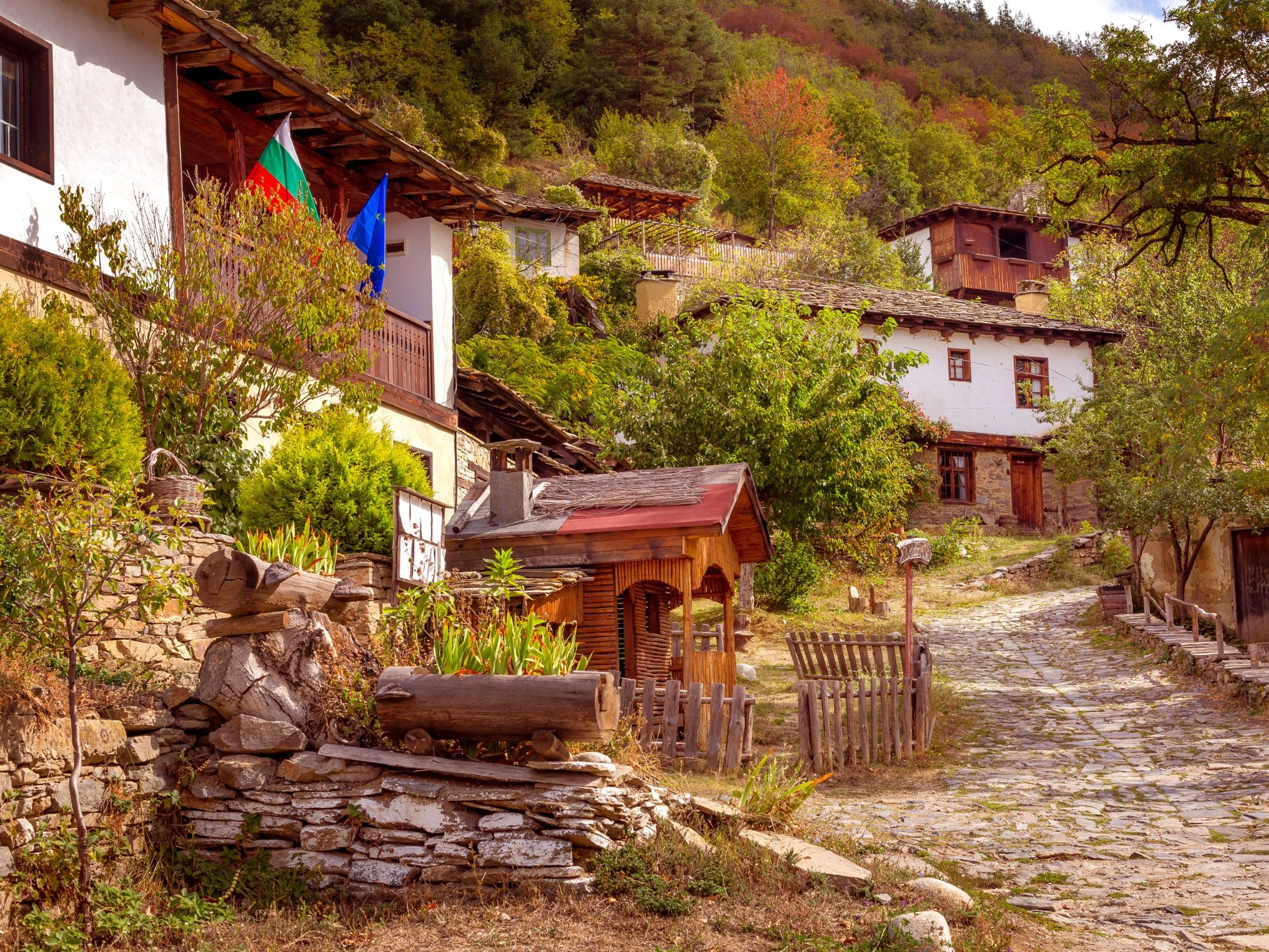 Leshten Village in Spring - Blooming trees surround rustic Leshten houses, showcasing Bulgaria’s rural charm.