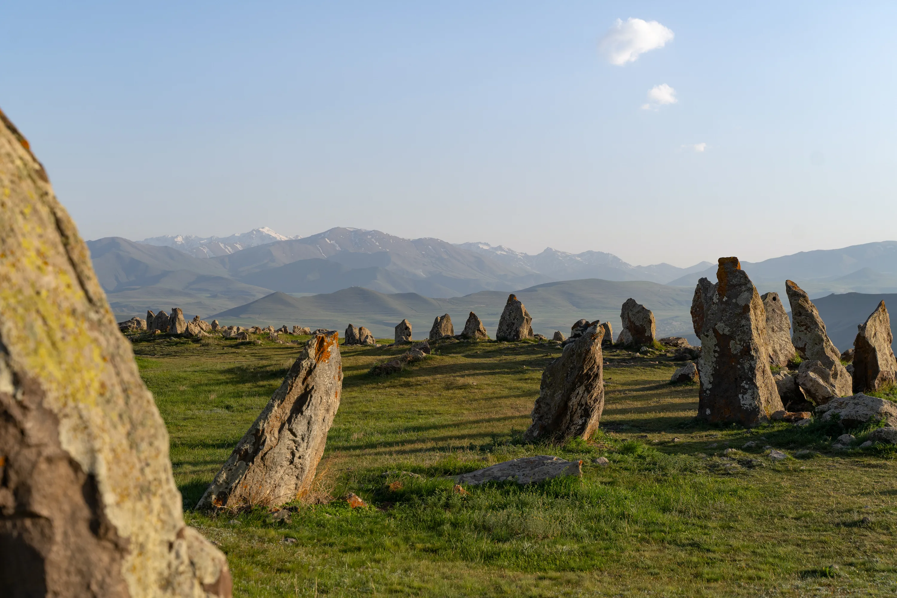 Zorats Karer, Armenia’s ancient megalithic site, featuring standing stones with mountain views.