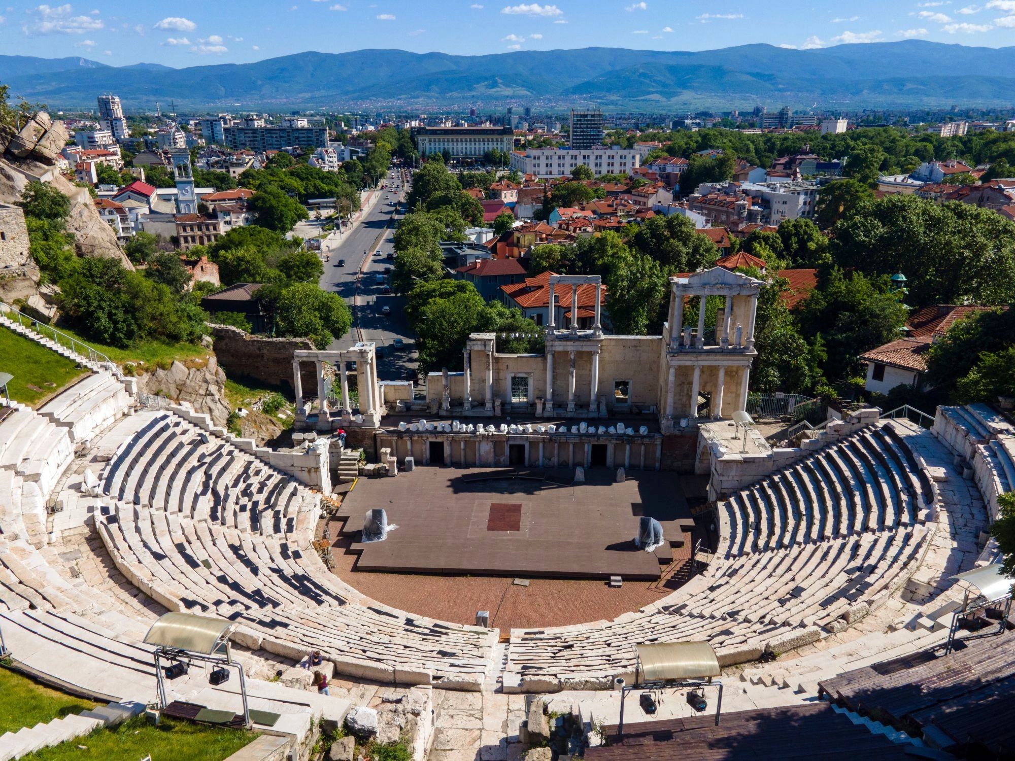 Roman theatre in Plovdiv, Bulgaria with panoramic city and mountain views.