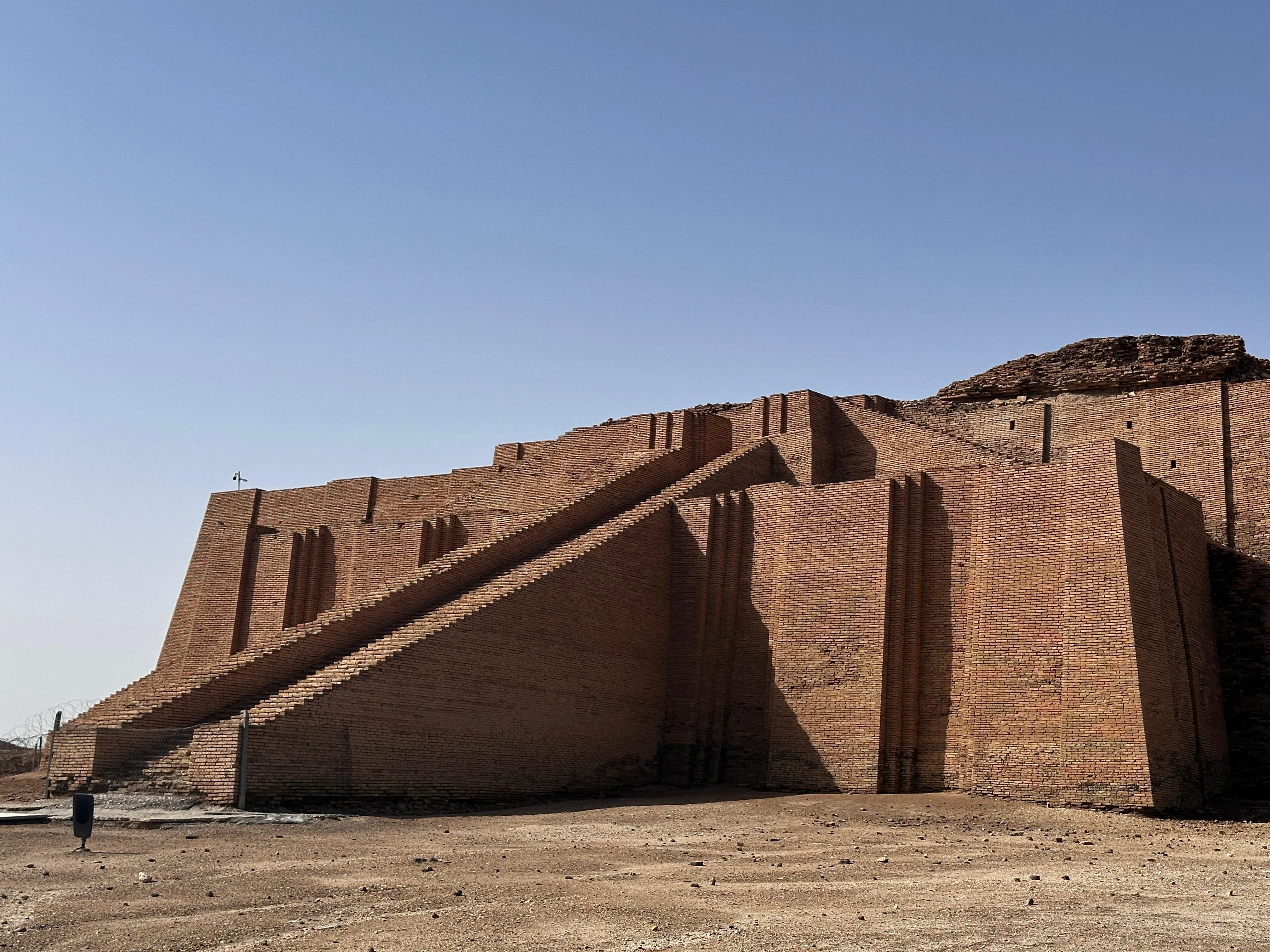 Ziggurat of Ur in Iraq under a clear sky, showcasing ancient Mesopotamian stepped pyramid architecture