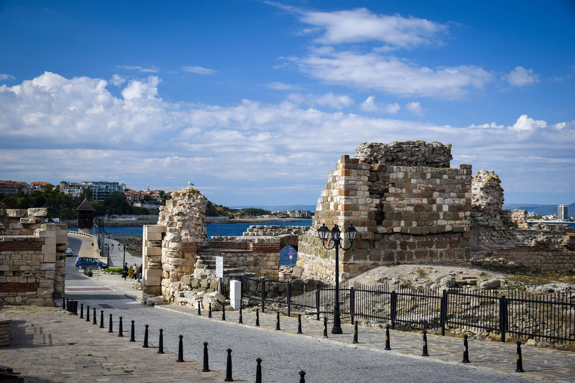 Ancient stone walls of Nessebar, Bulgaria, overlooking the Black Sea under a bright blue sky