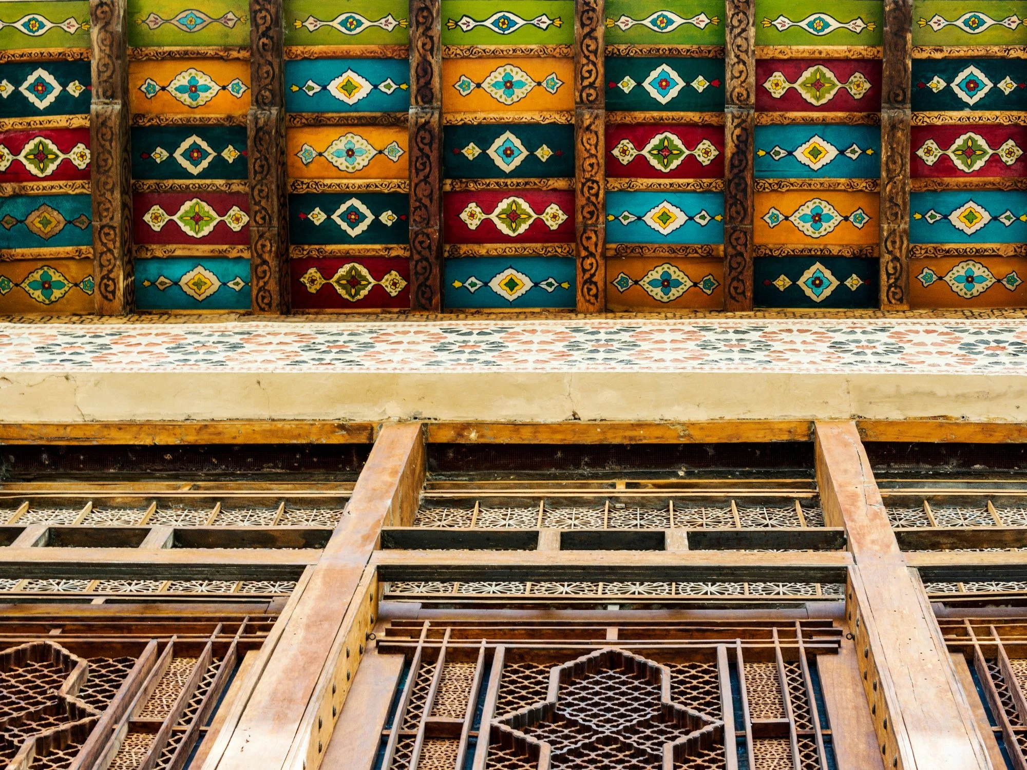 Ornate painted wooden ceiling and lattice windows of Sheki Khan’s Palace in Azerbaijan