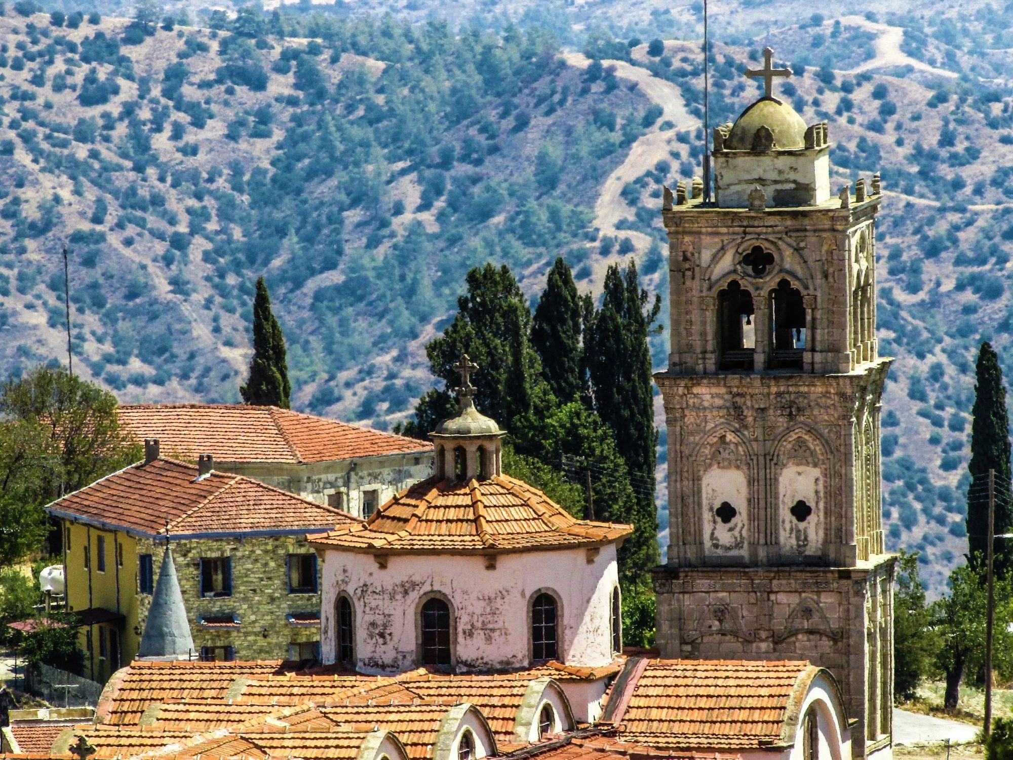 Scenic bell tower and hillside view in a traditional Cyprus mountain village.