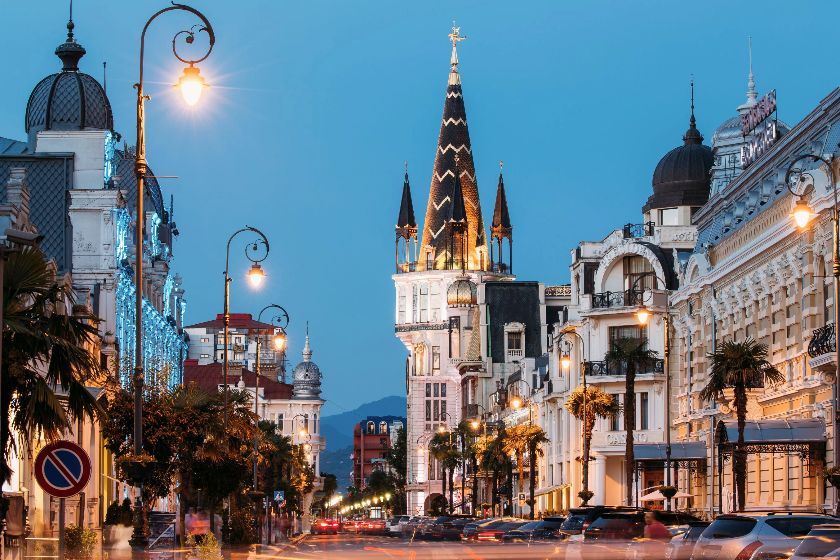 Batumi Piazza Square at night with illuminated clock tower, European-style architecture, and vibrant city lights in Batumi, Georgia