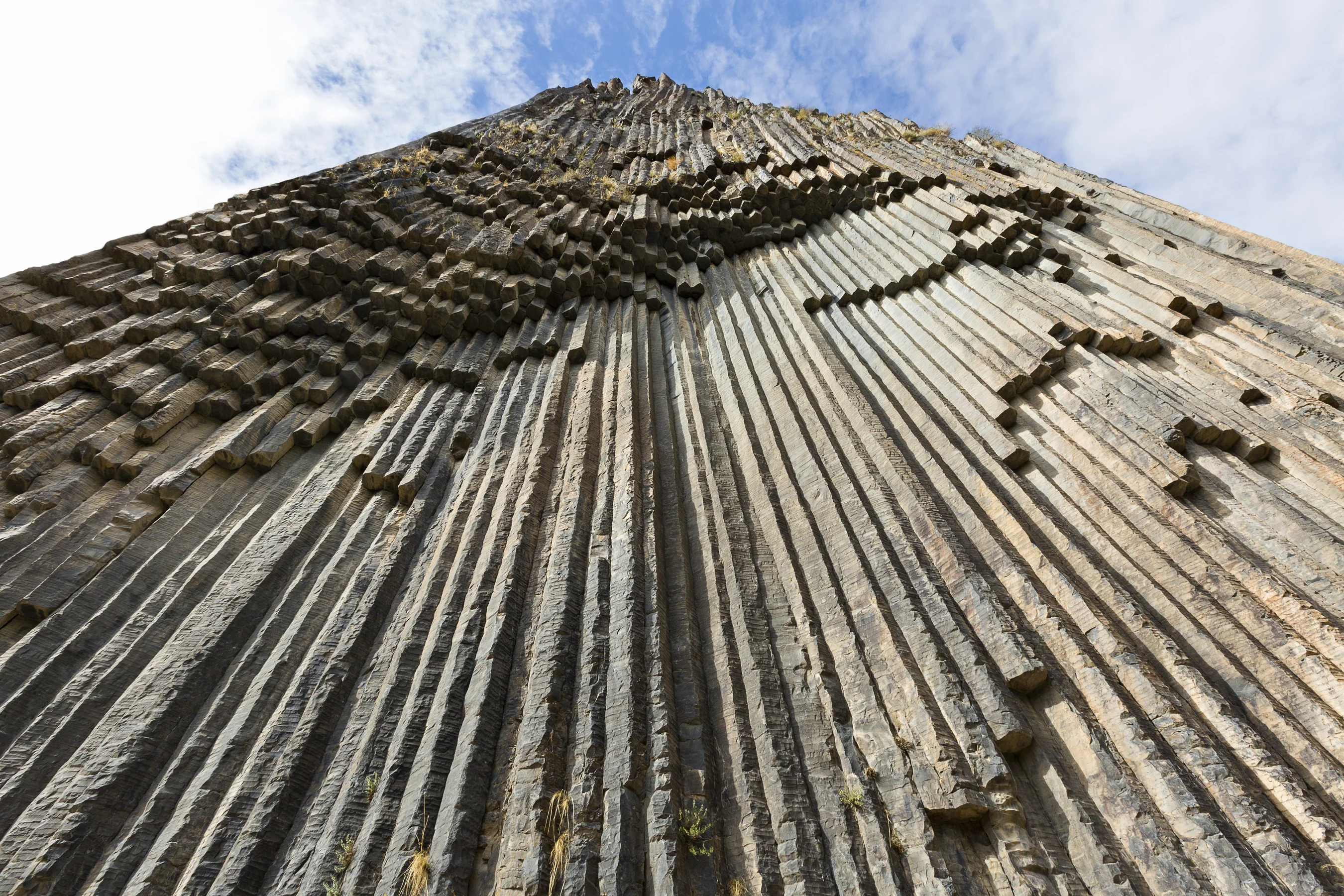Symphony of Stones Armenia – upward view of basalt column formations resembling organ pipes near the Garni Gorge.
