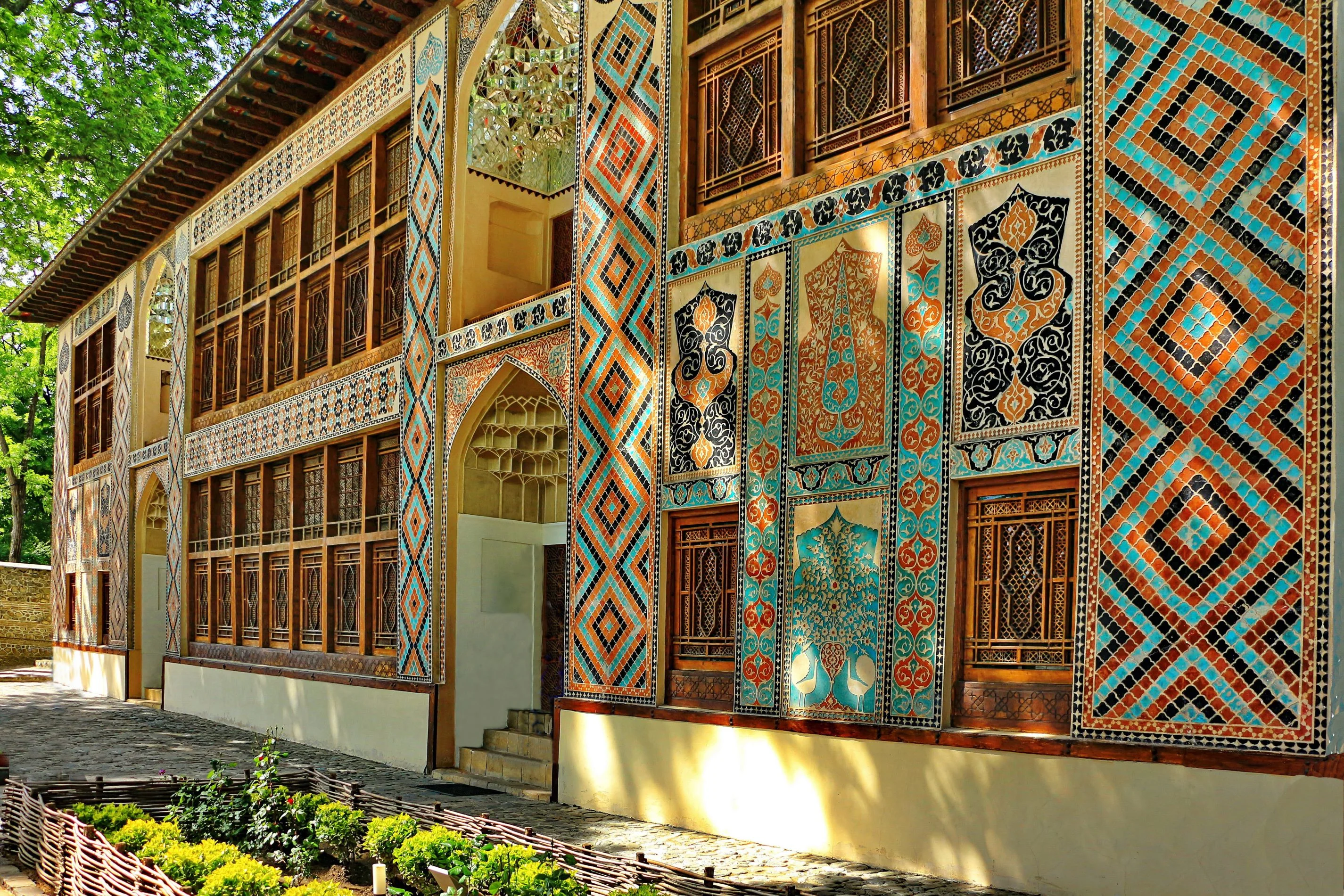 Sheki Khan’s Palace – ornate exterior of Sheki Khan’s Palace in Azerbaijan featuring intricate stained glass and colorful mosaics.