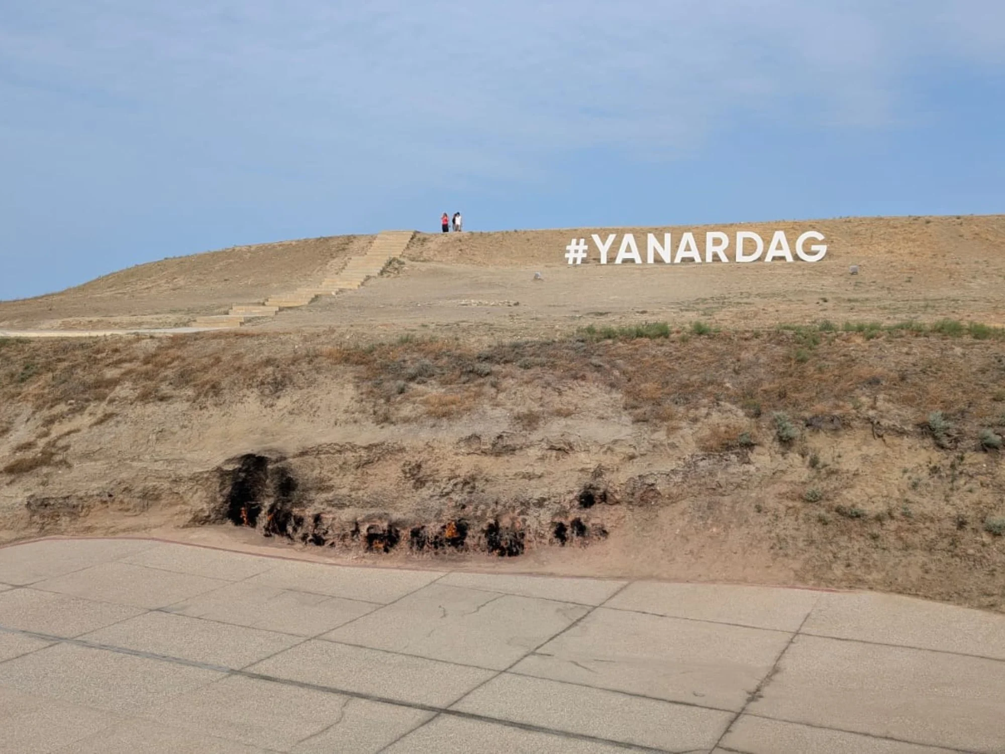 Hillside at Yanardag, the Burning Mountain near Baku, with the #YANARDAG sign carved into the slope