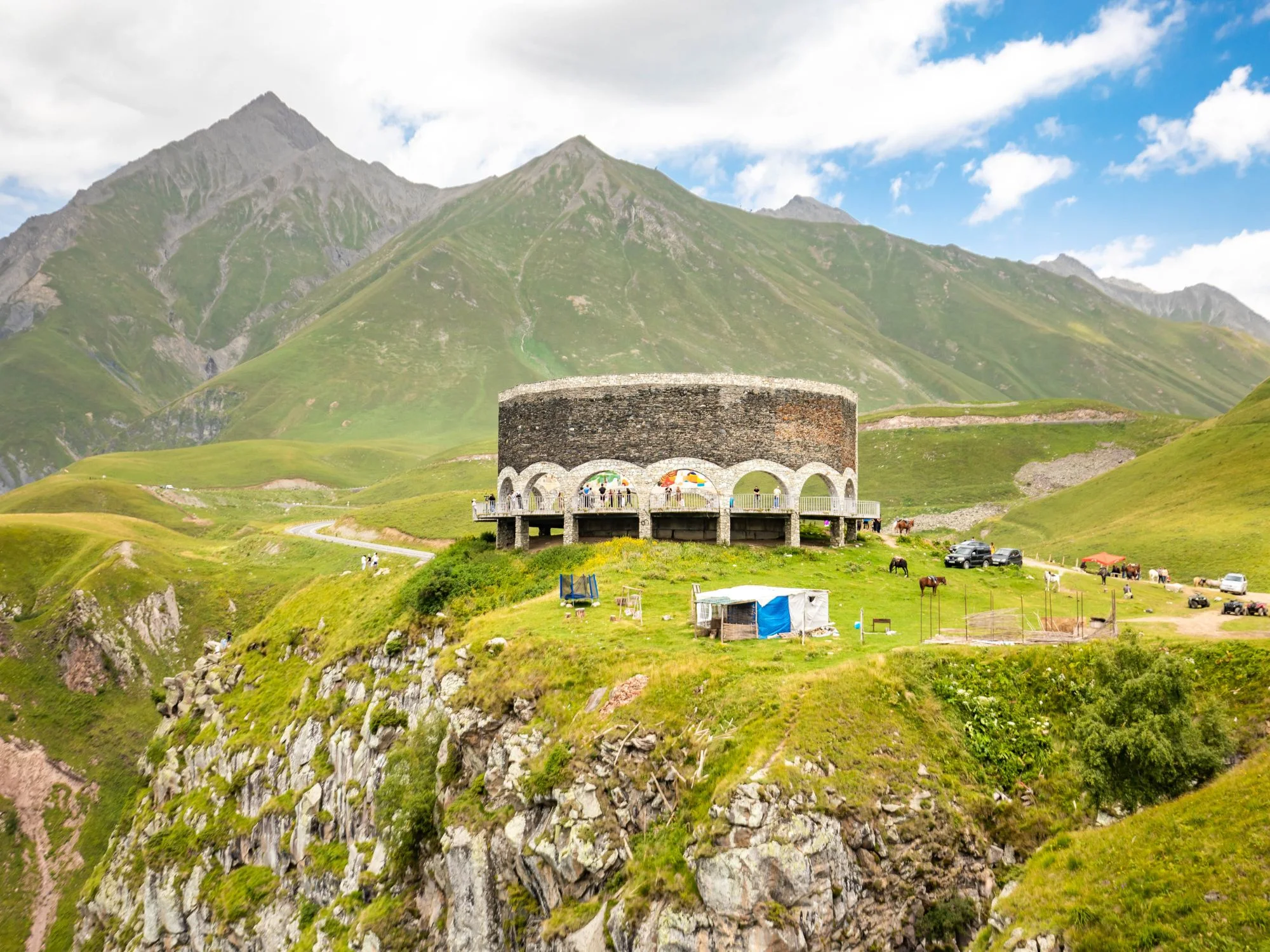 Russia-Georgia Friendship Monument arching over the Caucasus landscape at Gudauri Pass