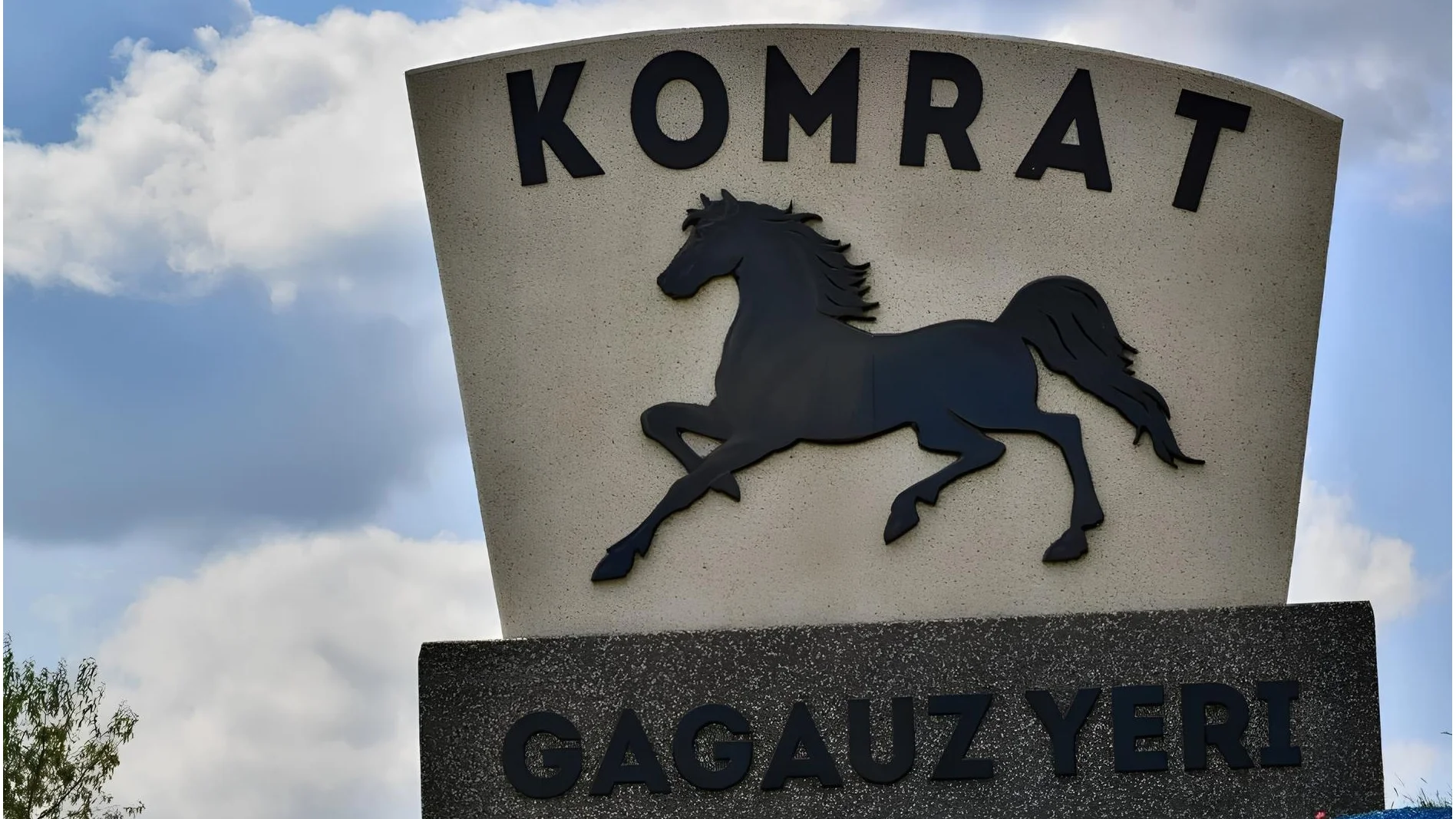 Town entry monument reading "Komrat Gagauz Yeri" with a black horse silhouette, Gagauzia, Moldova