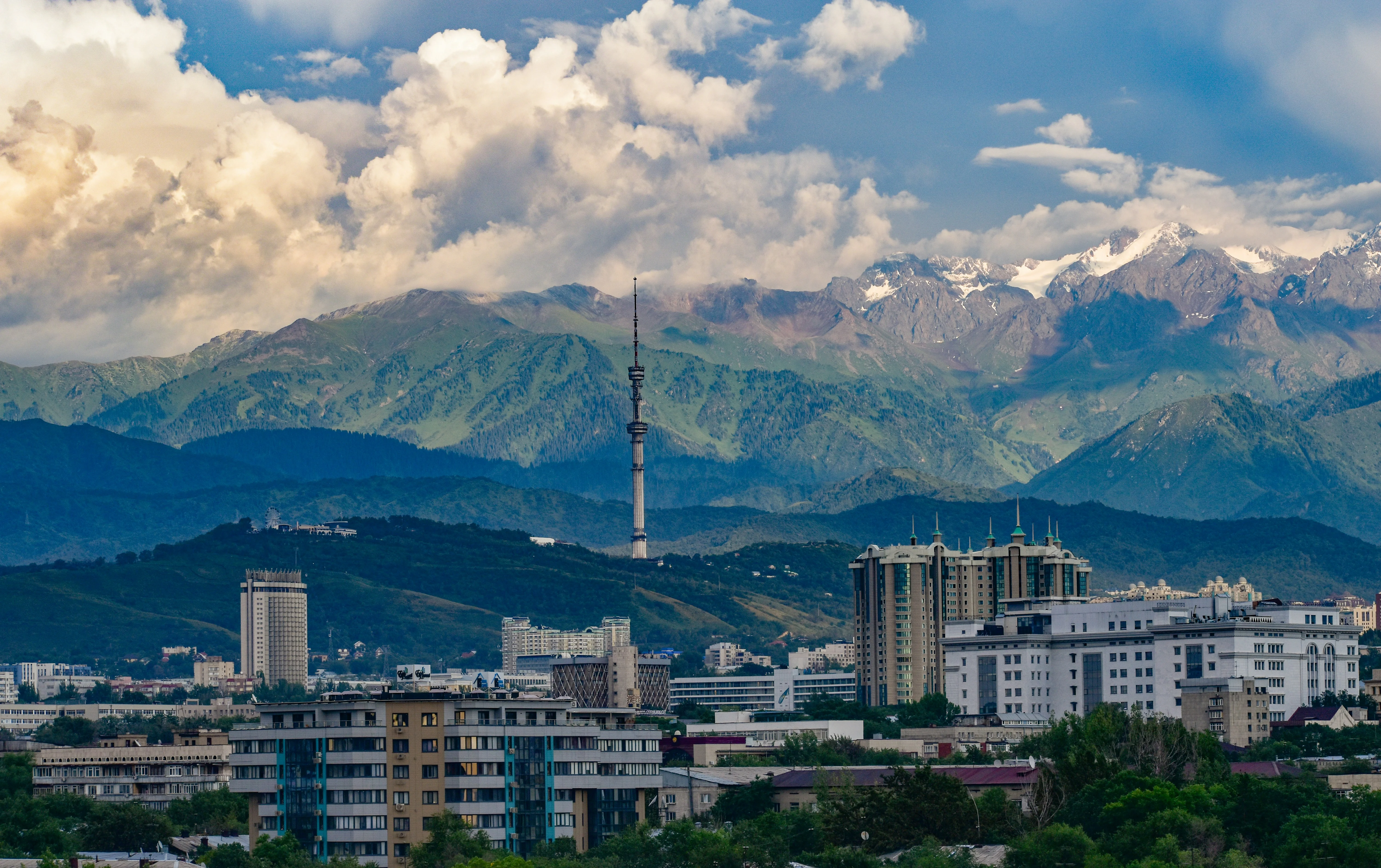 Almaty's modern skyline with the Kok-Tobe TV tower against the snow-capped Tian Shan range, Kazakhstan