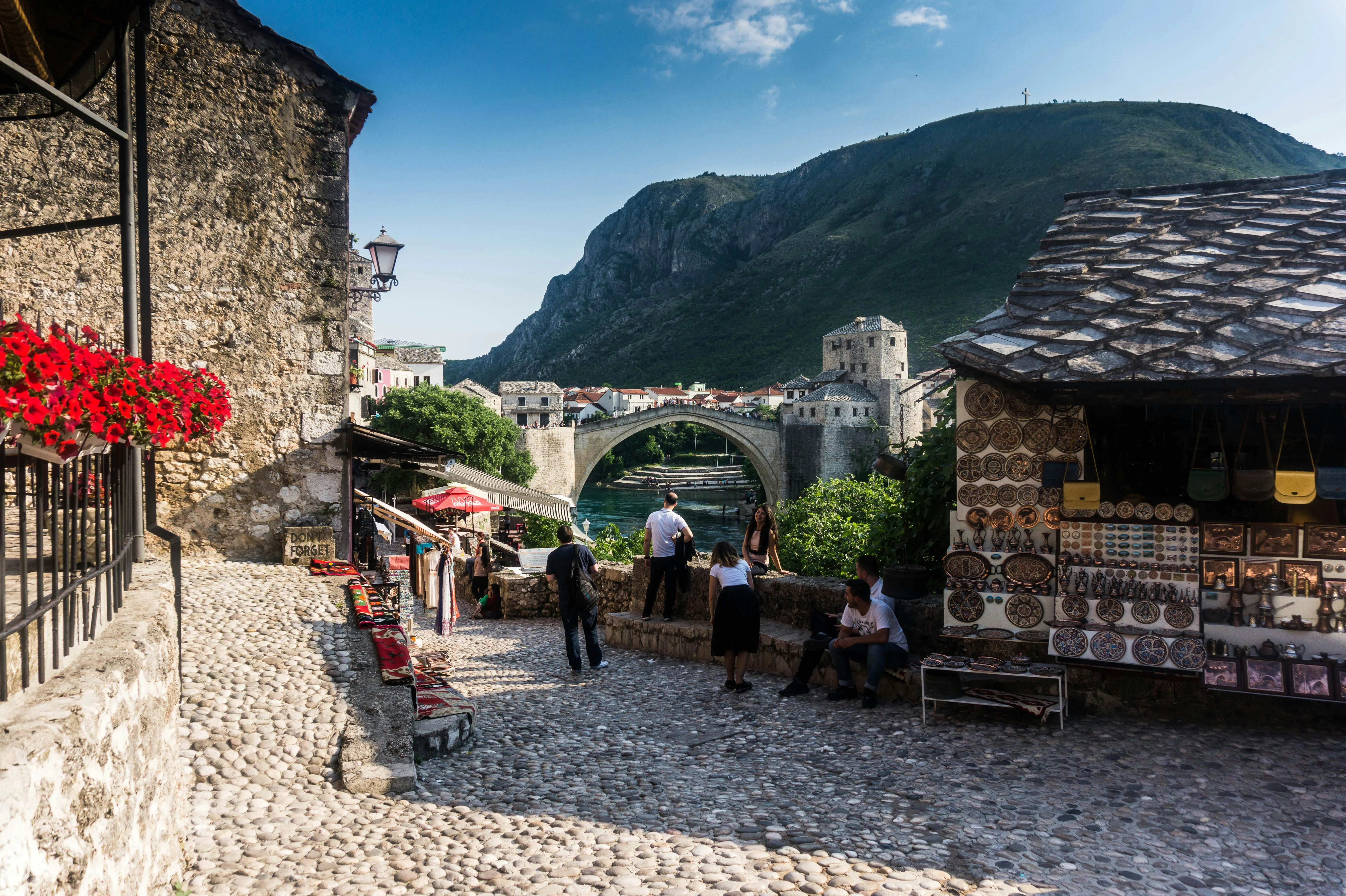 View of Mostar's Stari Most stone bridge from the cobbled Old Bazaar lane, Bosnia and Herzegovina