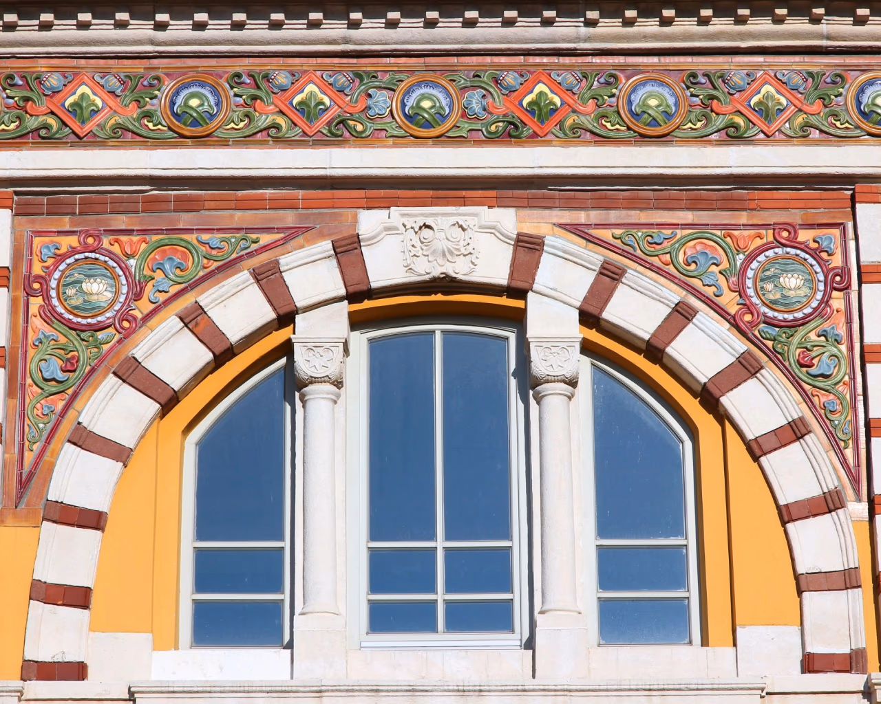 Sofia Central Mineral Baths facade with colorful tiles and arched window detail.