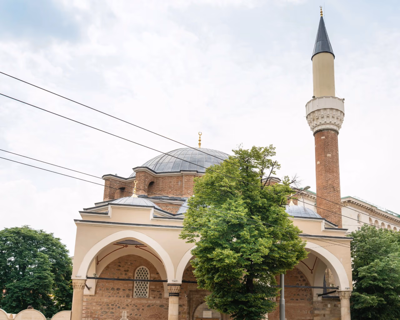 Banya Bashi Mosque minaret and domes in Sofia, Bulgaria historic Ottoman landmark
