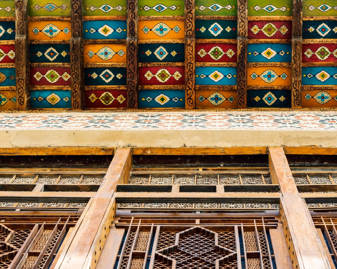 Ornate painted wooden ceiling and lattice windows of Sheki Khan’s Palace in Azerbaijan