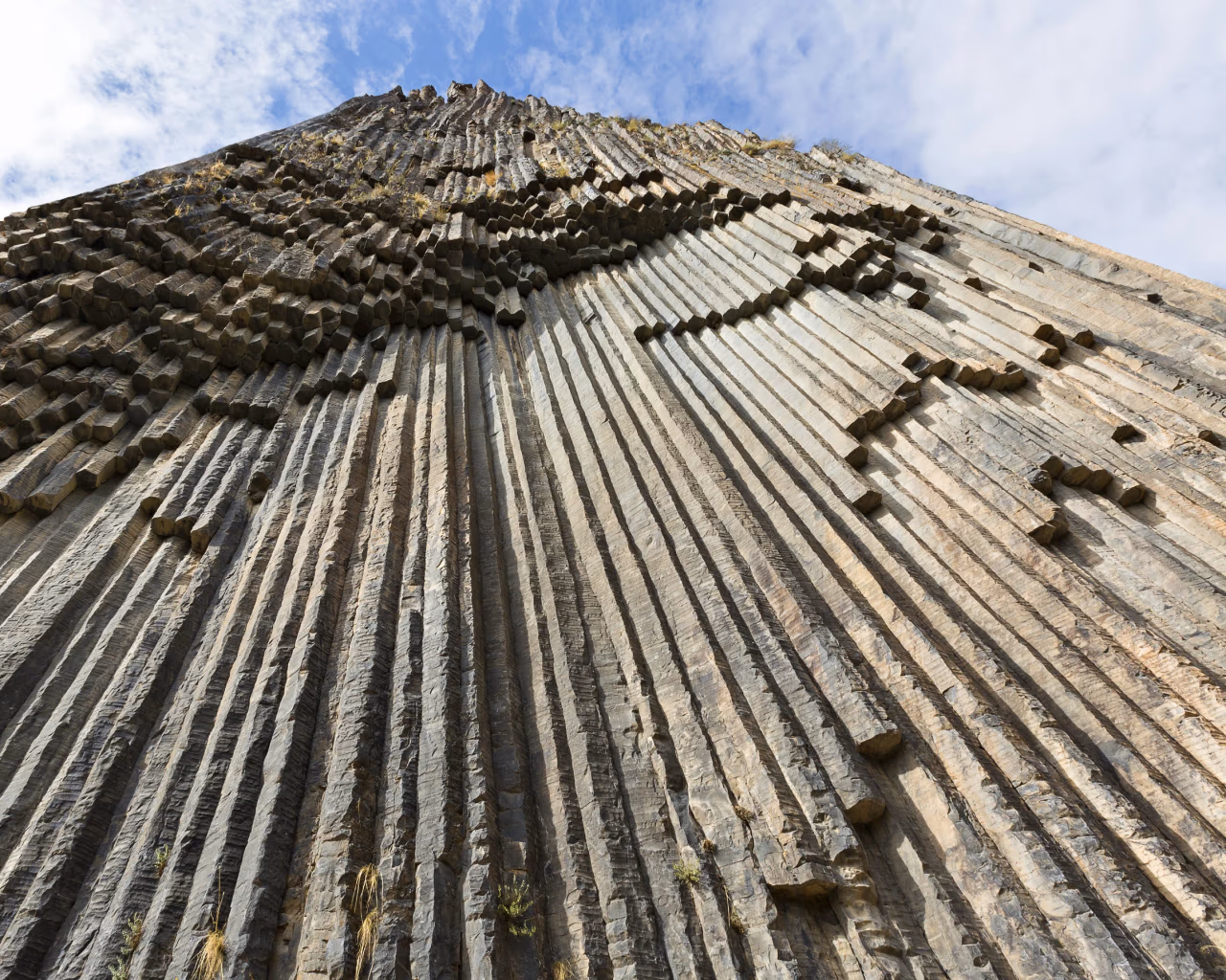 Symphony of Stones Armenia – upward view of basalt column formations resembling organ pipes near the Garni Gorge.