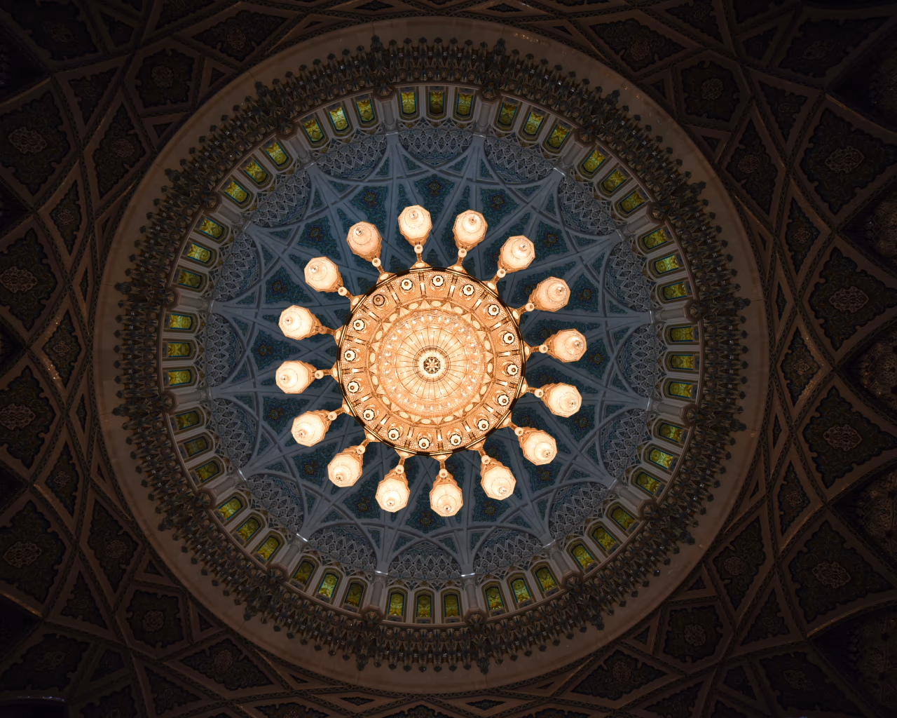 Ornate chandelier inside Sultan Qaboos Grand Mosque seen during an Oman tour.