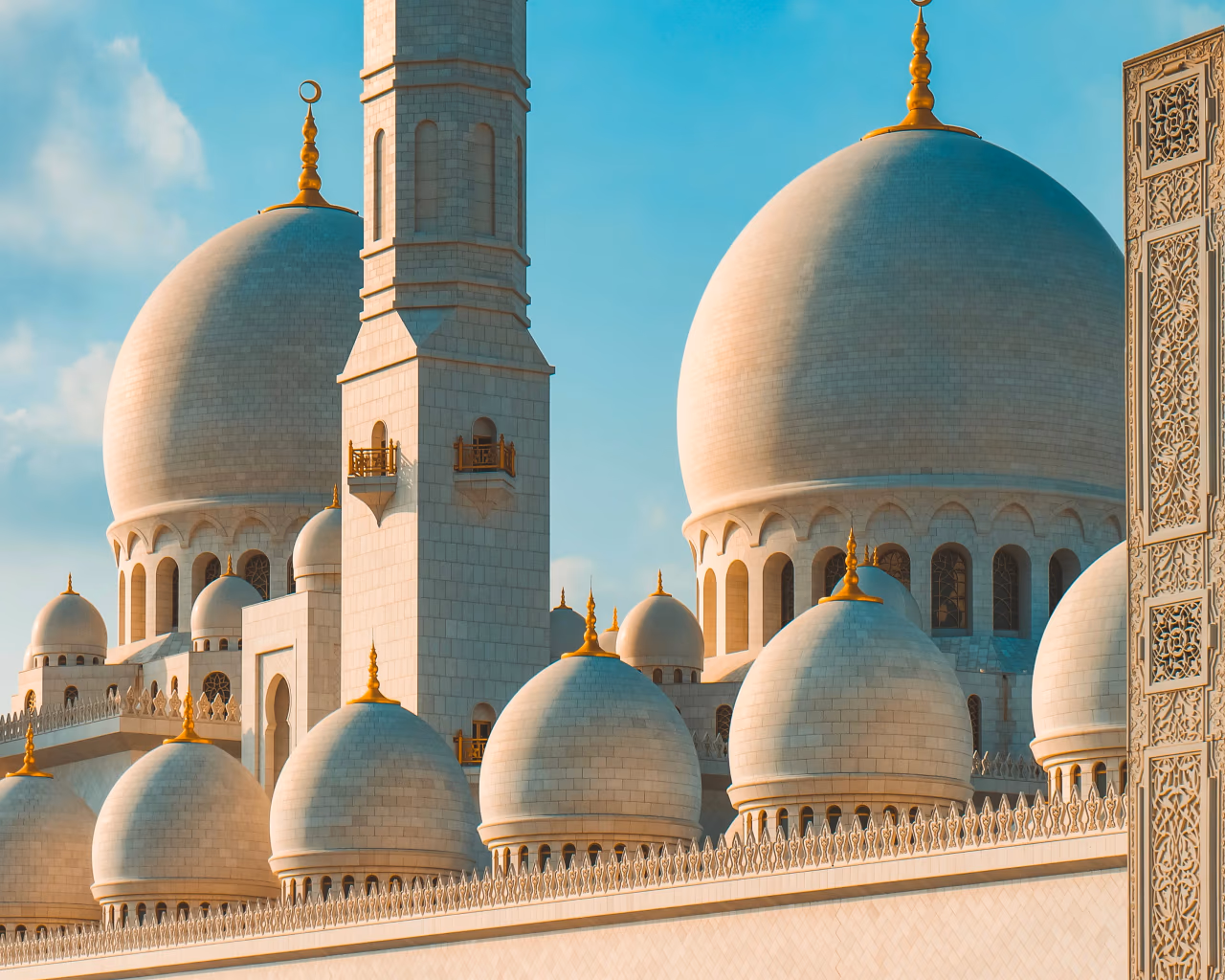 Sheikh Zayed Grand Mosque domes and minaret with golden details