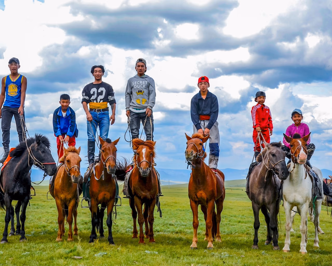 Sweeping view of the Mongolian steppe with traditional gers under the vast eternal blue sky