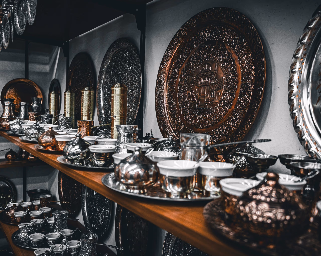 Traditional Bosnian copperware and coffee sets displayed in a Sarajevo bazaar.