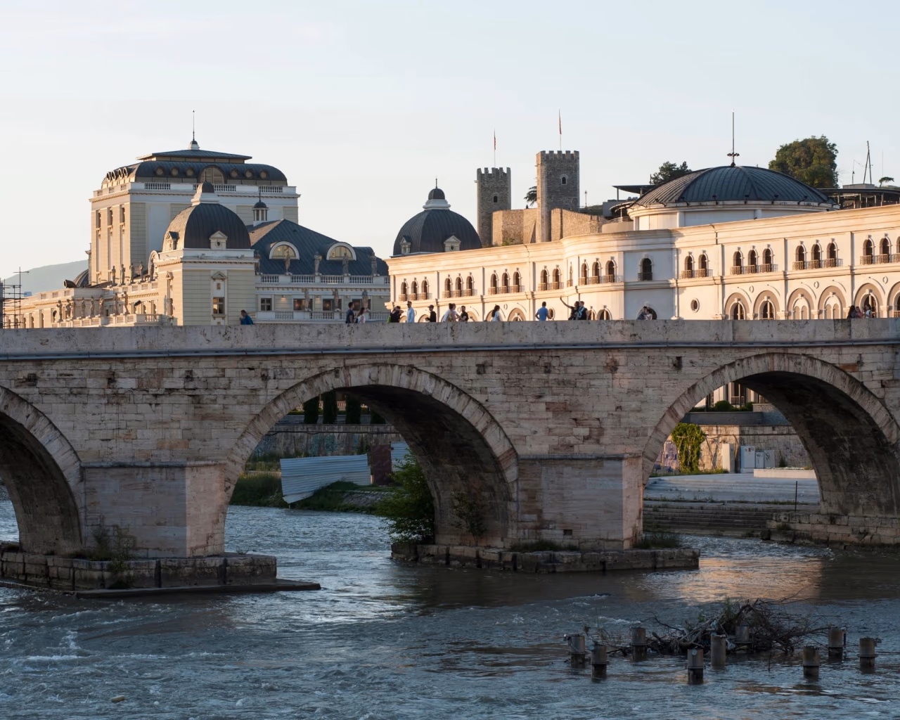 Stone Bridge over Vardar River with Skopje Fortress and neoclassical buildings in Skopje, North Macedonia.