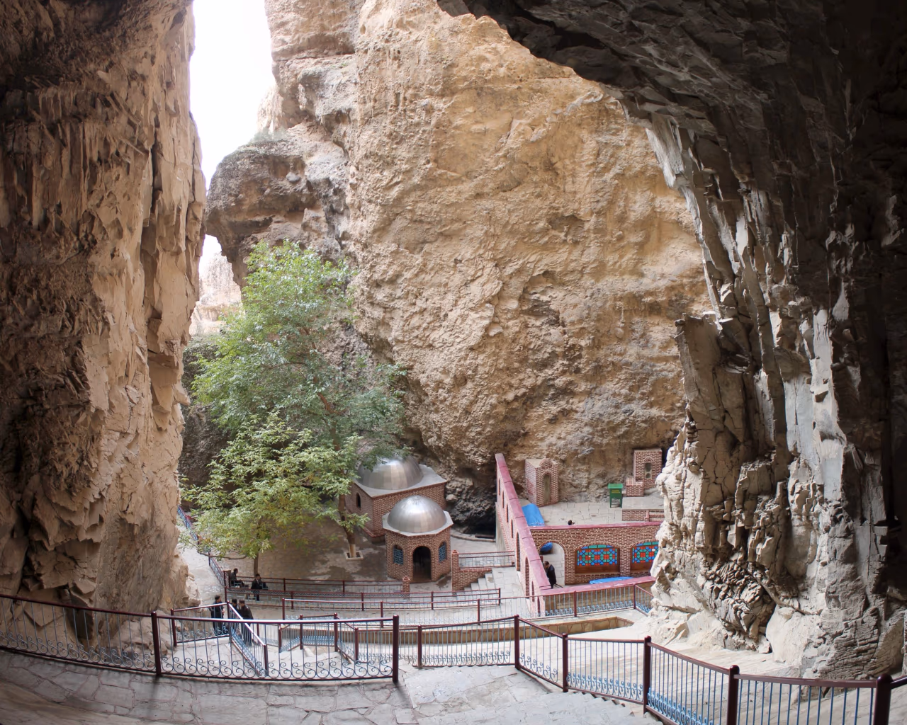 Sunlit Alinja Castle ruins overlook the dry, mountainous valley of Nakhchivan.