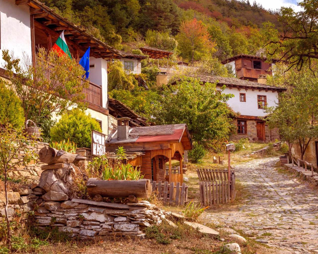 Leshten Village in Spring - Blooming trees surround rustic Leshten houses, showcasing Bulgaria’s rural charm.