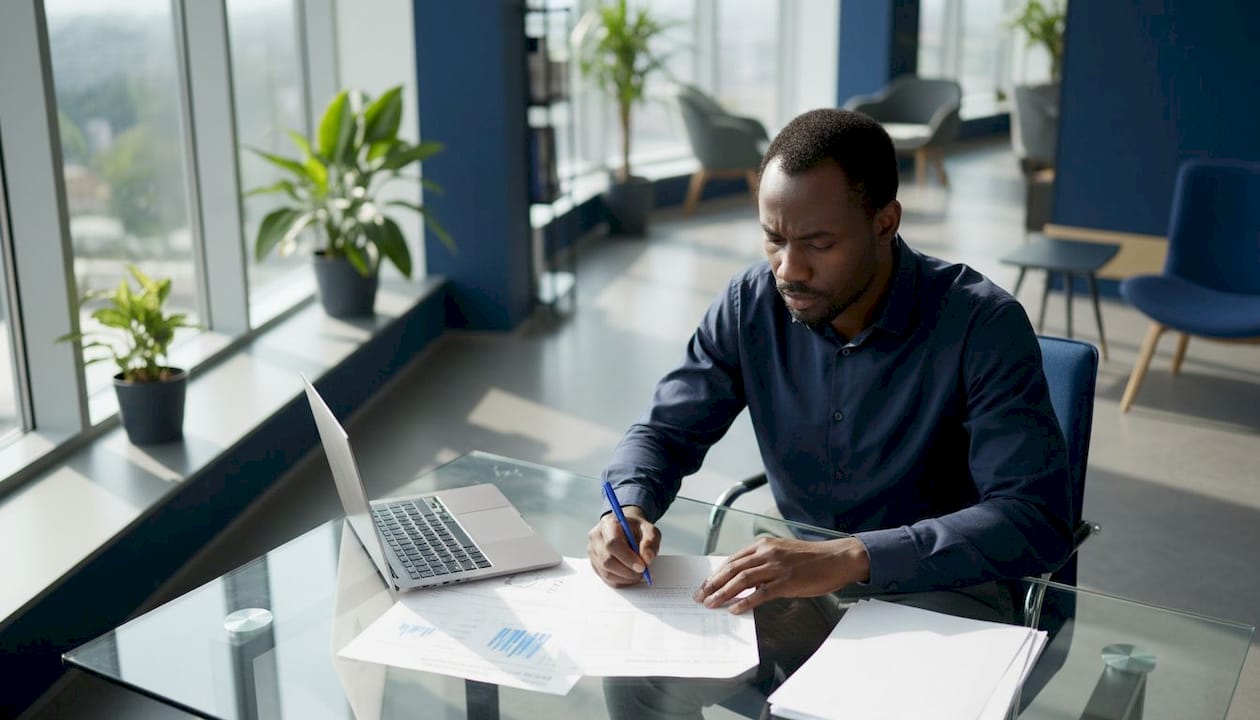 Logistics analyst reviewing delivery reports