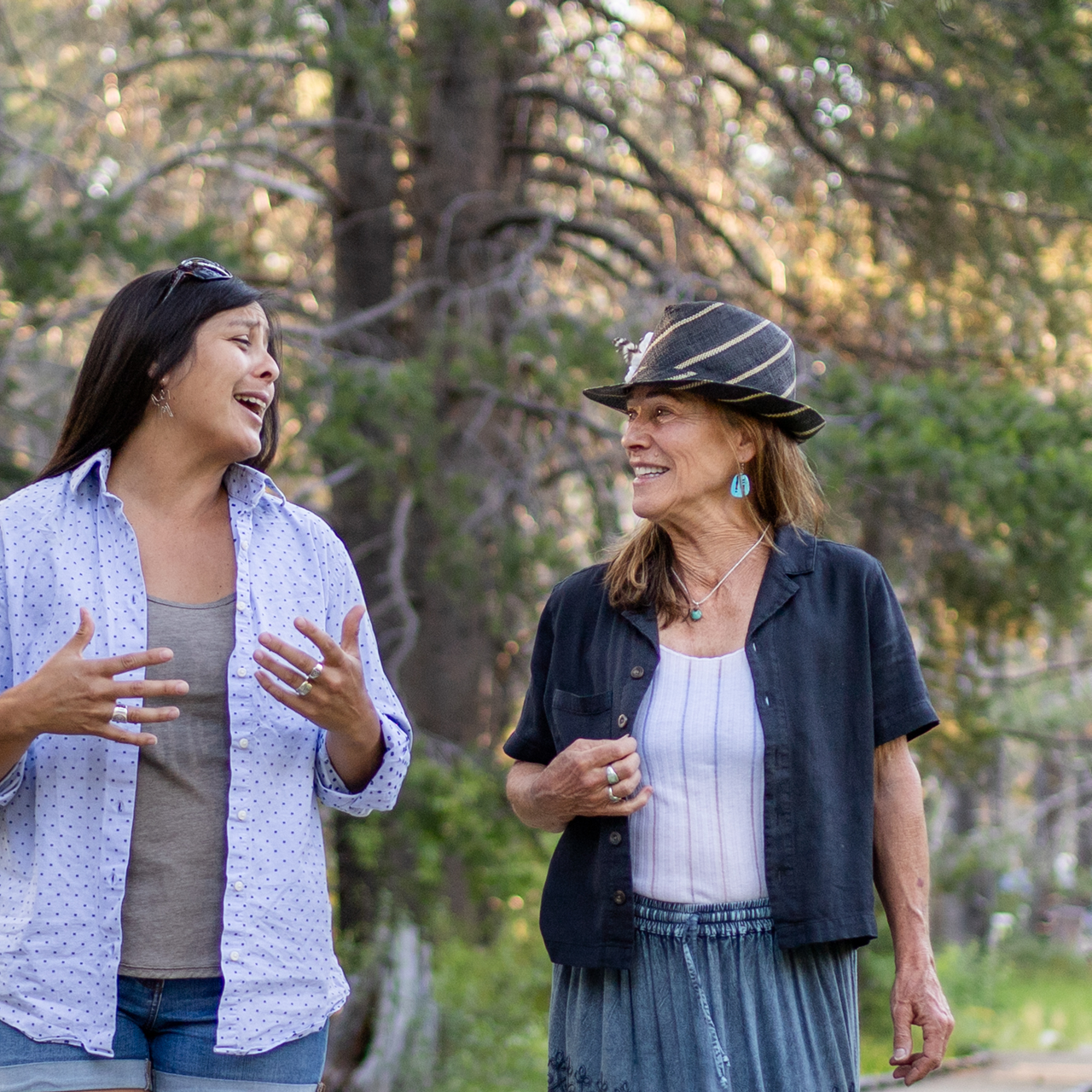 Barbi Buckles walking and conversing with a client.
