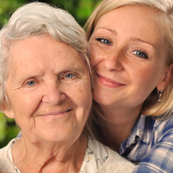Mother and daughter looking at camera