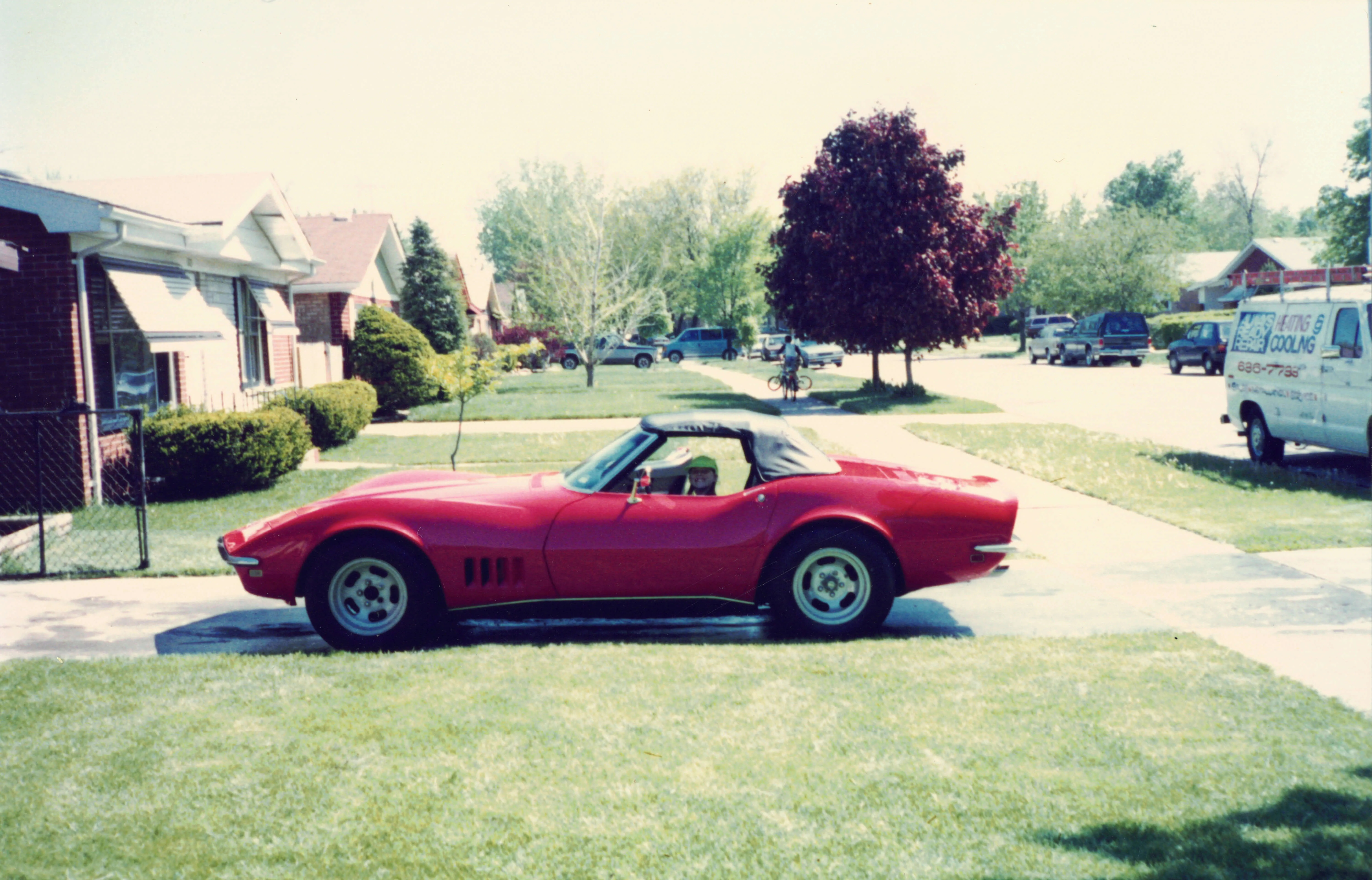 Classic car parked in a suburban driveway, from the Always Ready Repair family archive