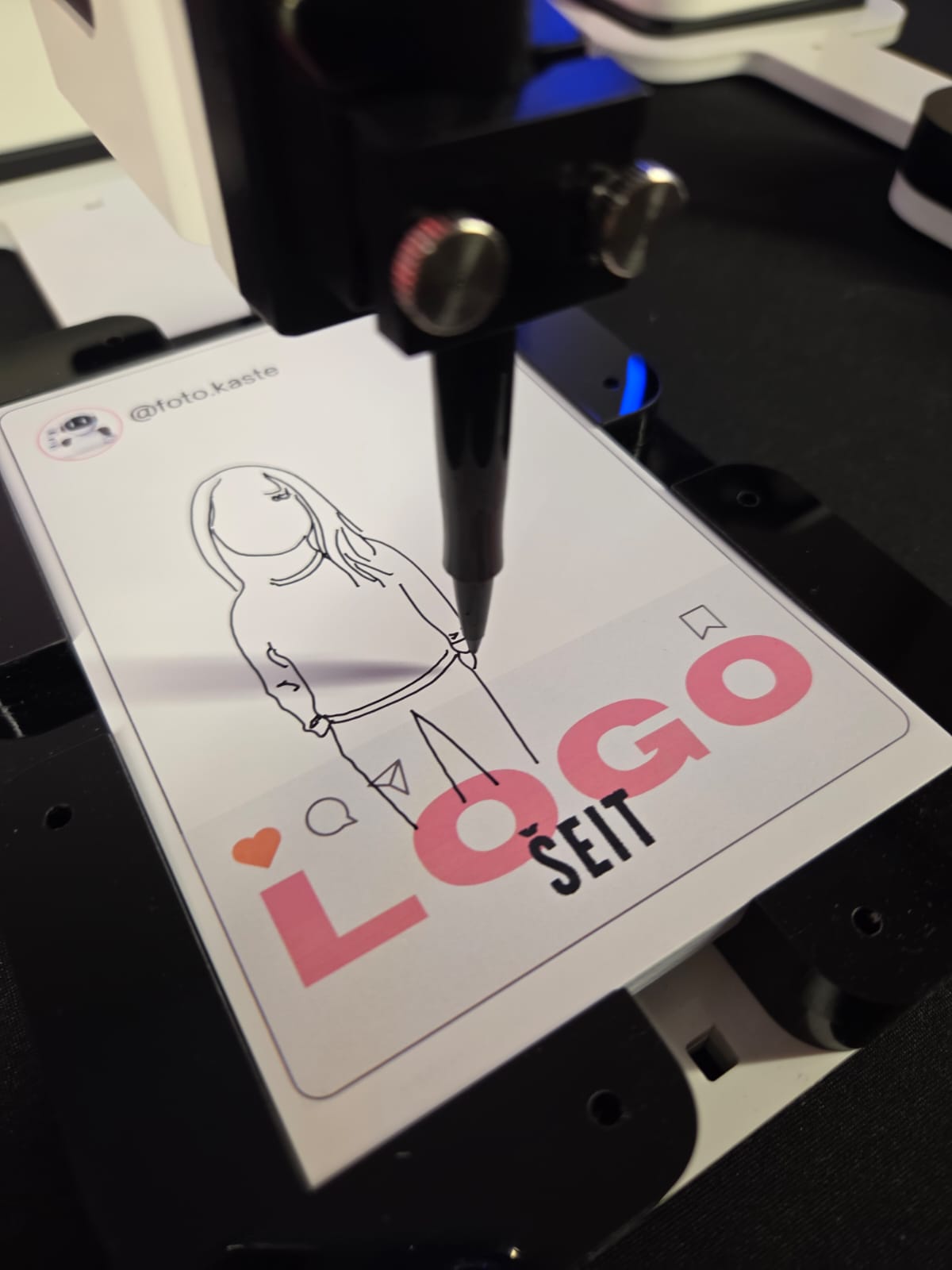 A pen drawing a minimalist line sketch of a person on a card with social media icons and the words 'LOGO SEIT'.