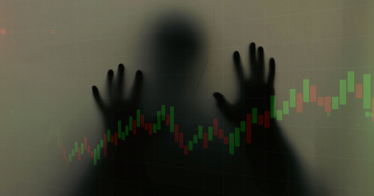 Silhouette with stock trading candlestick chart overlay