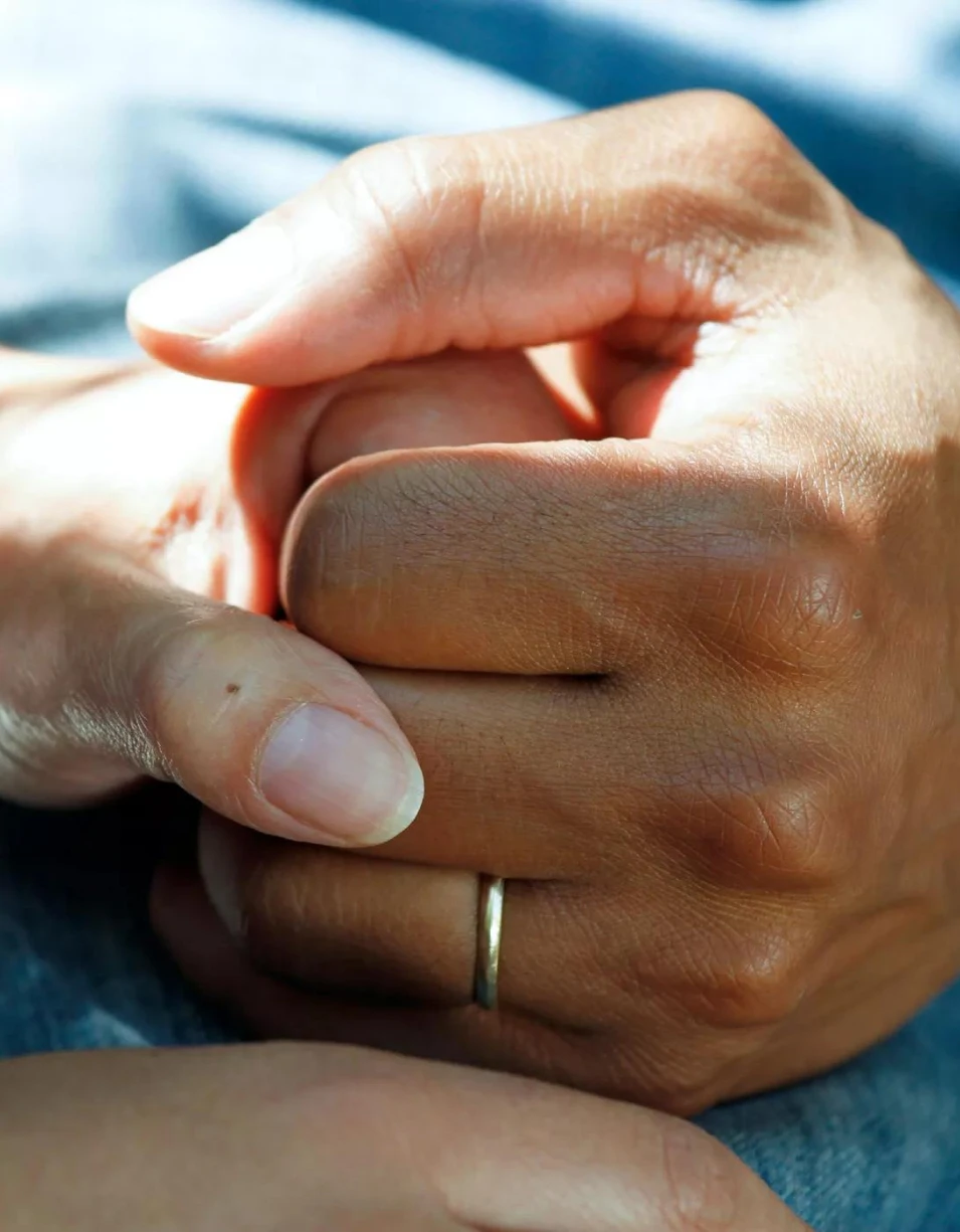 Hands held in support