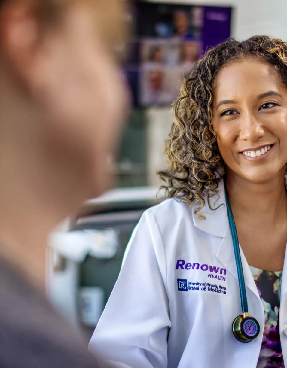 Doctor smiling in a clinical setting